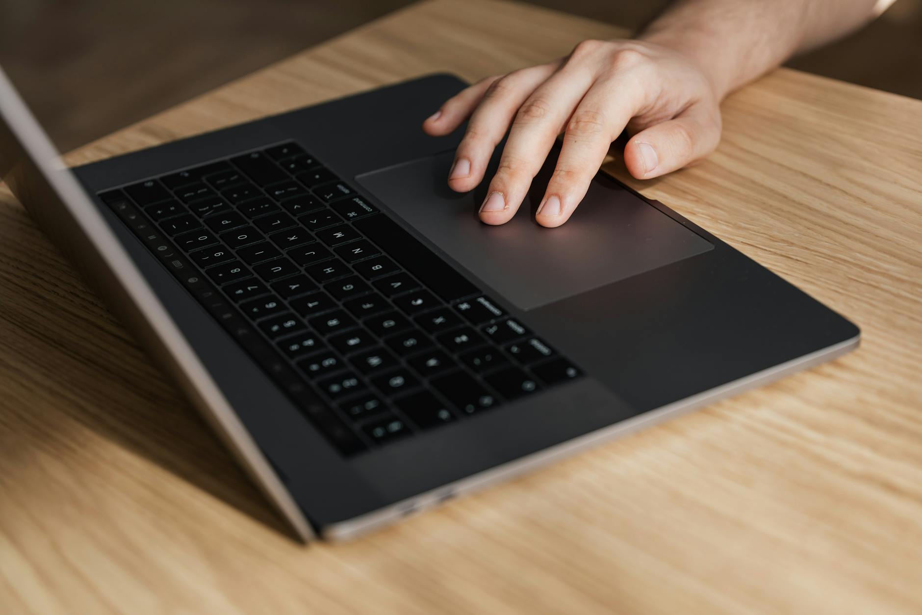 Product team reviewing an accessible website design with contrast and keyboard navigation notes on a laptop