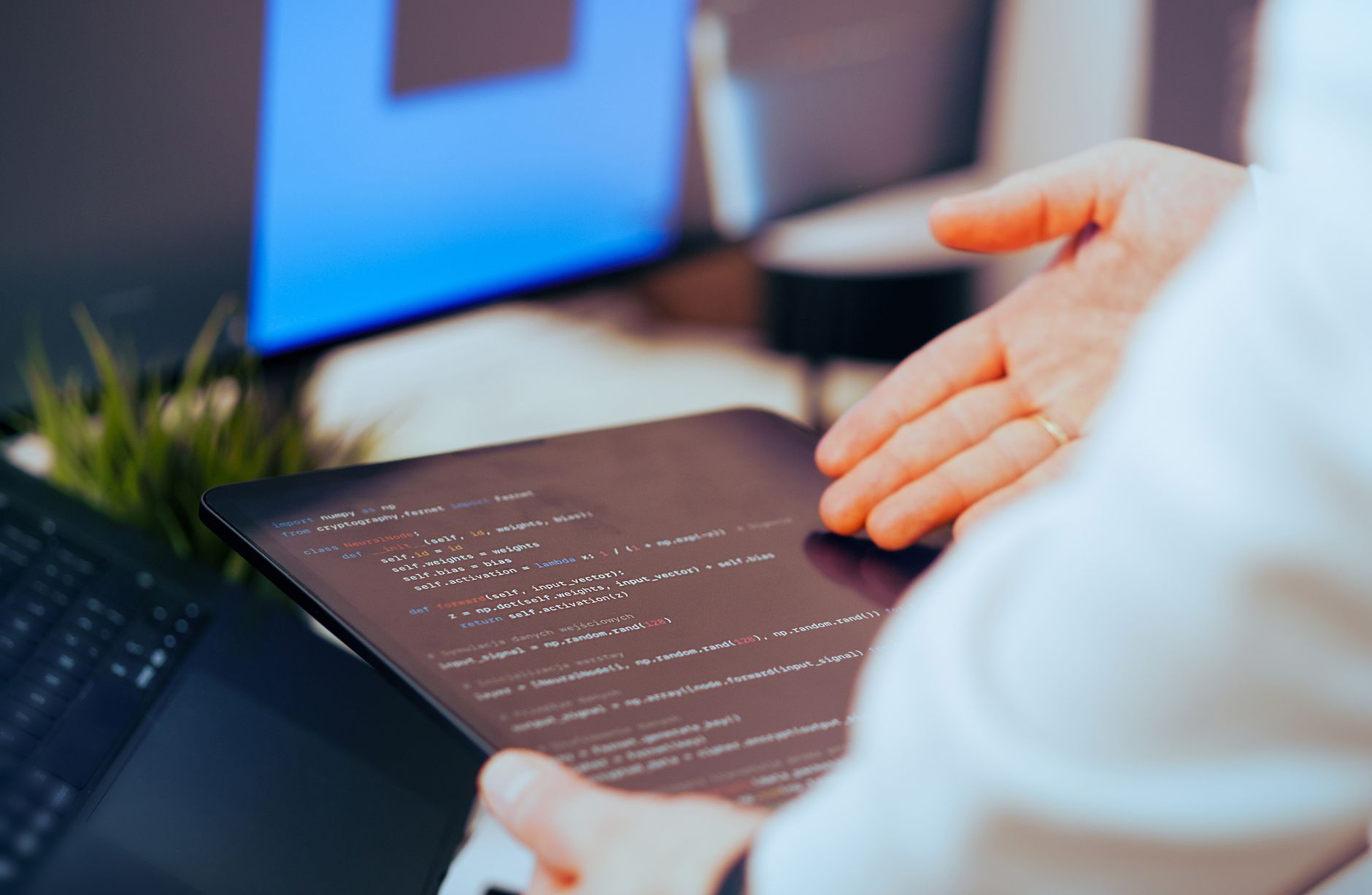 Accessibility specialist reviewing a WCAG conformance report on a laptop with notes and checklist