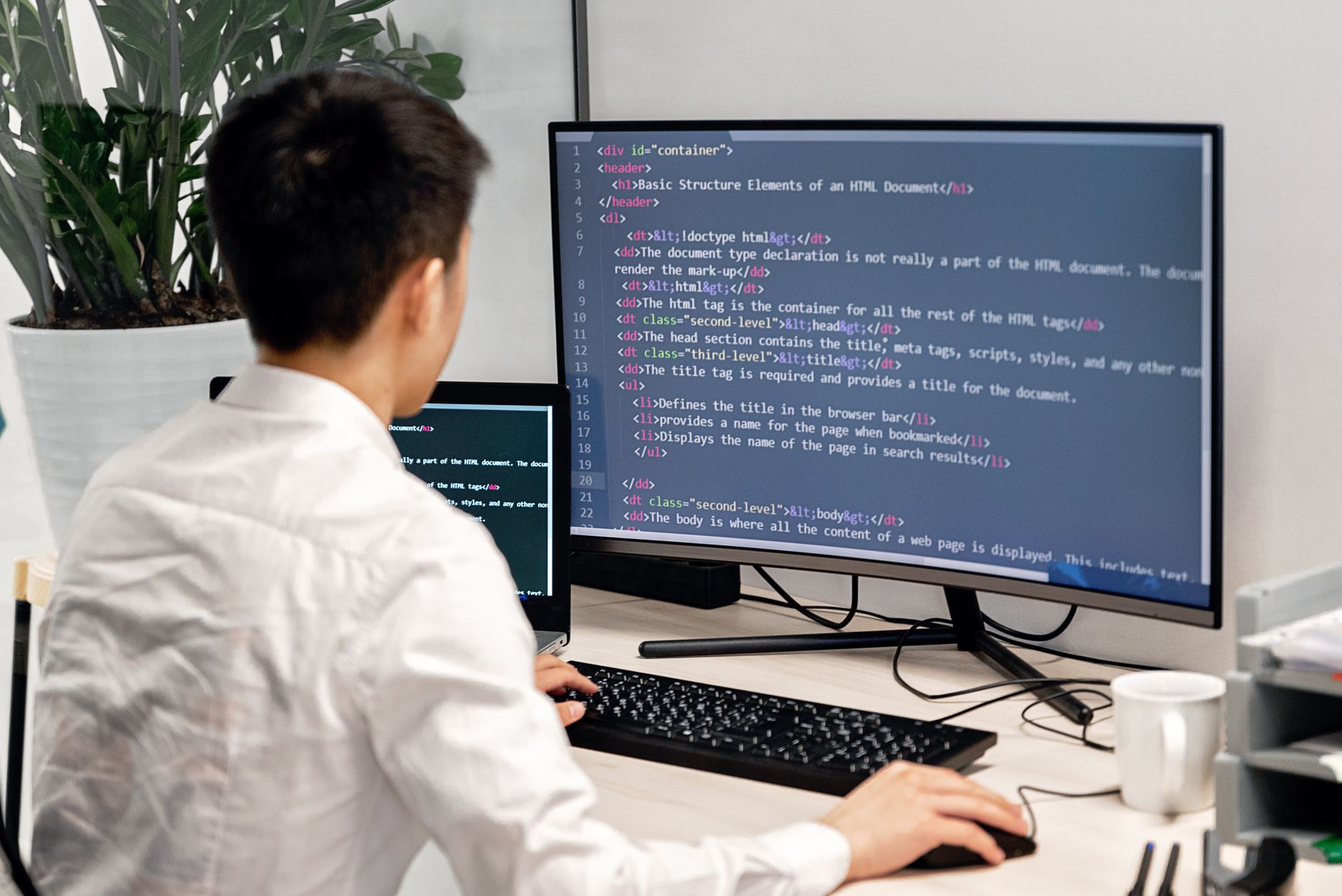 Person using a laptop with an accessibility settings panel open on screen