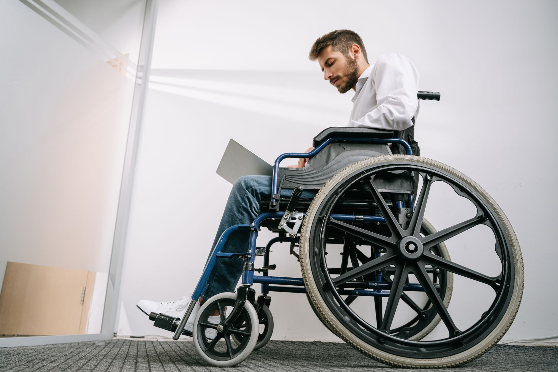 Person using a laptop with an accessibility settings panel open on screen