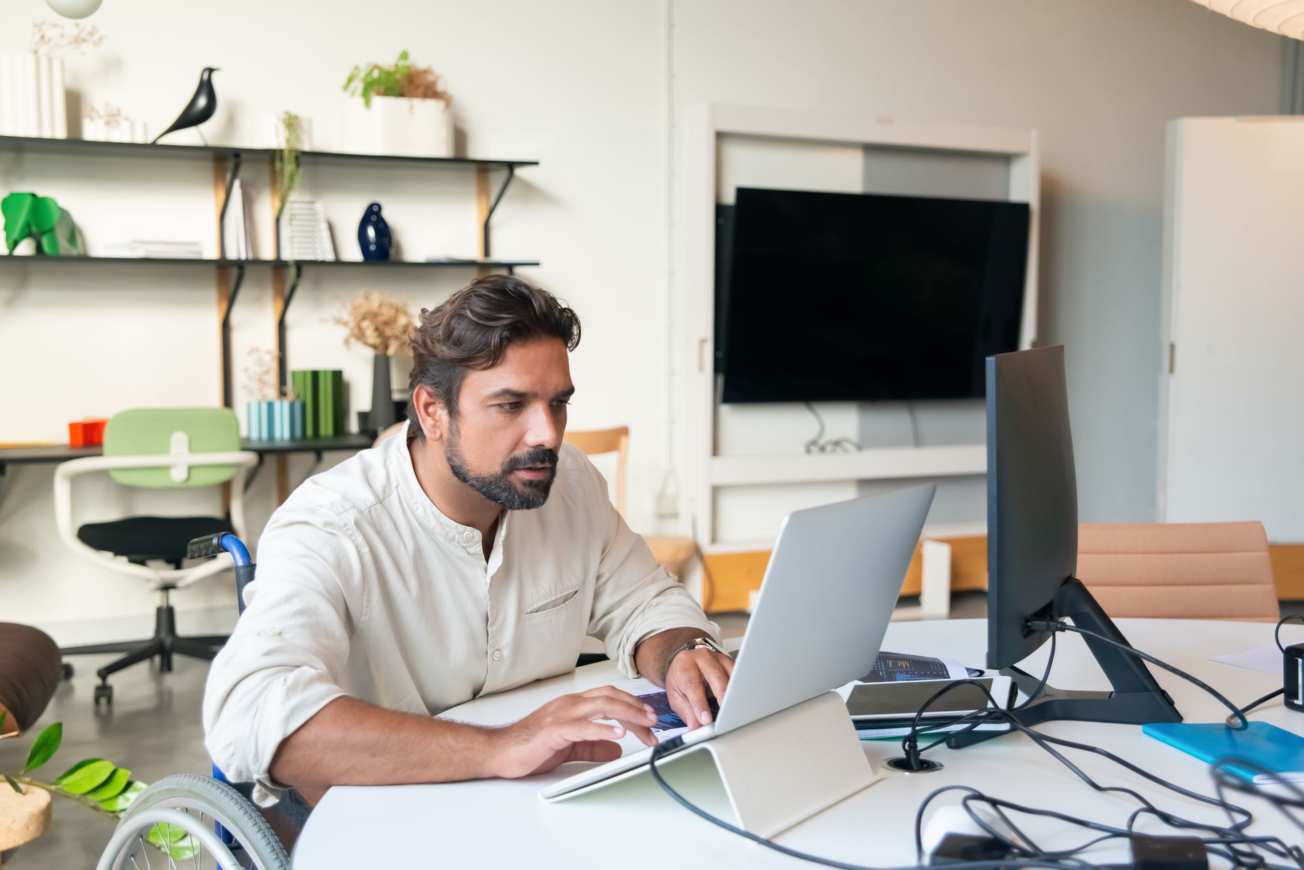 Product manager reviewing an AI task list for web accessibility fixes on a laptop