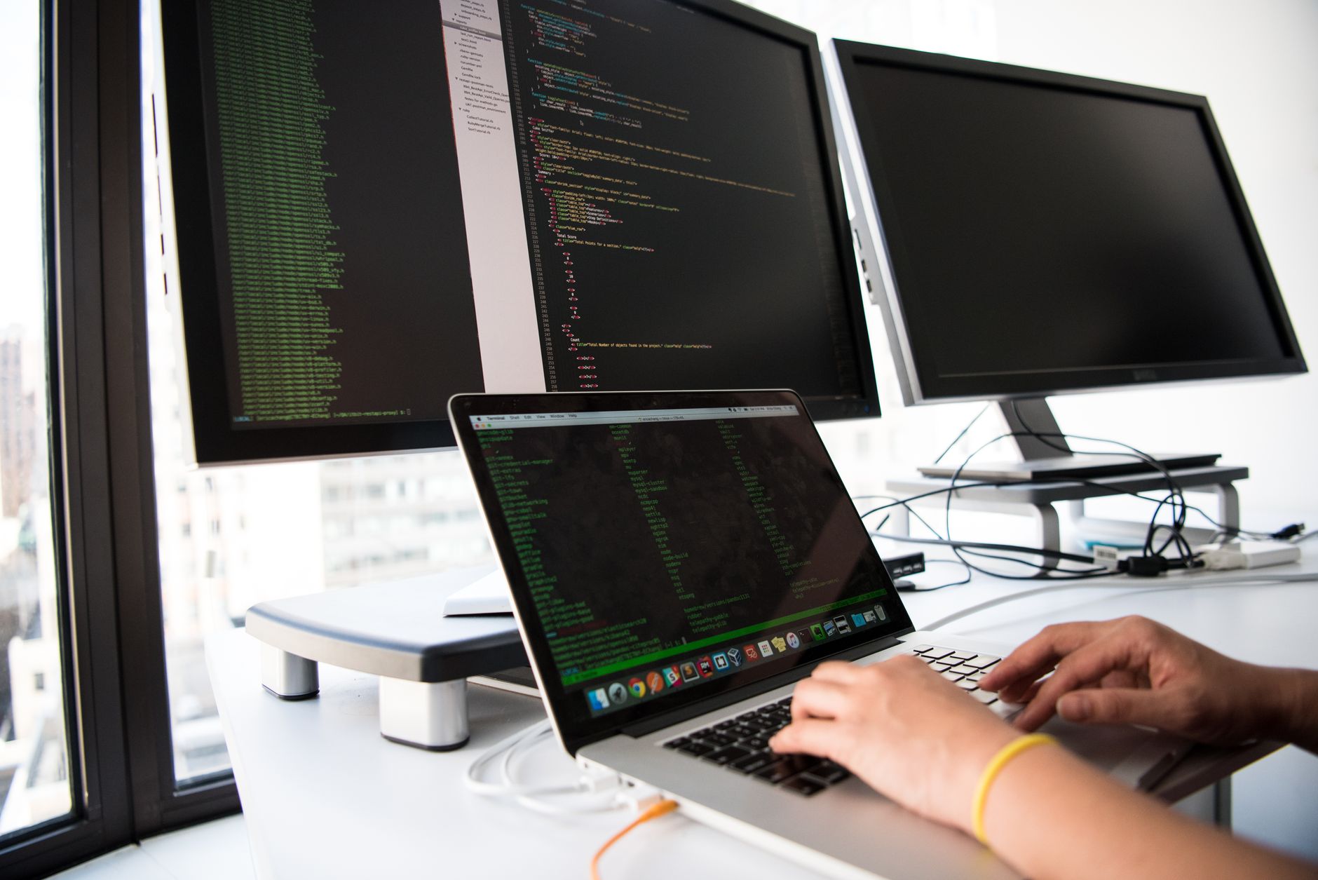 Product manager reviewing an AI task list for web accessibility fixes on a laptop