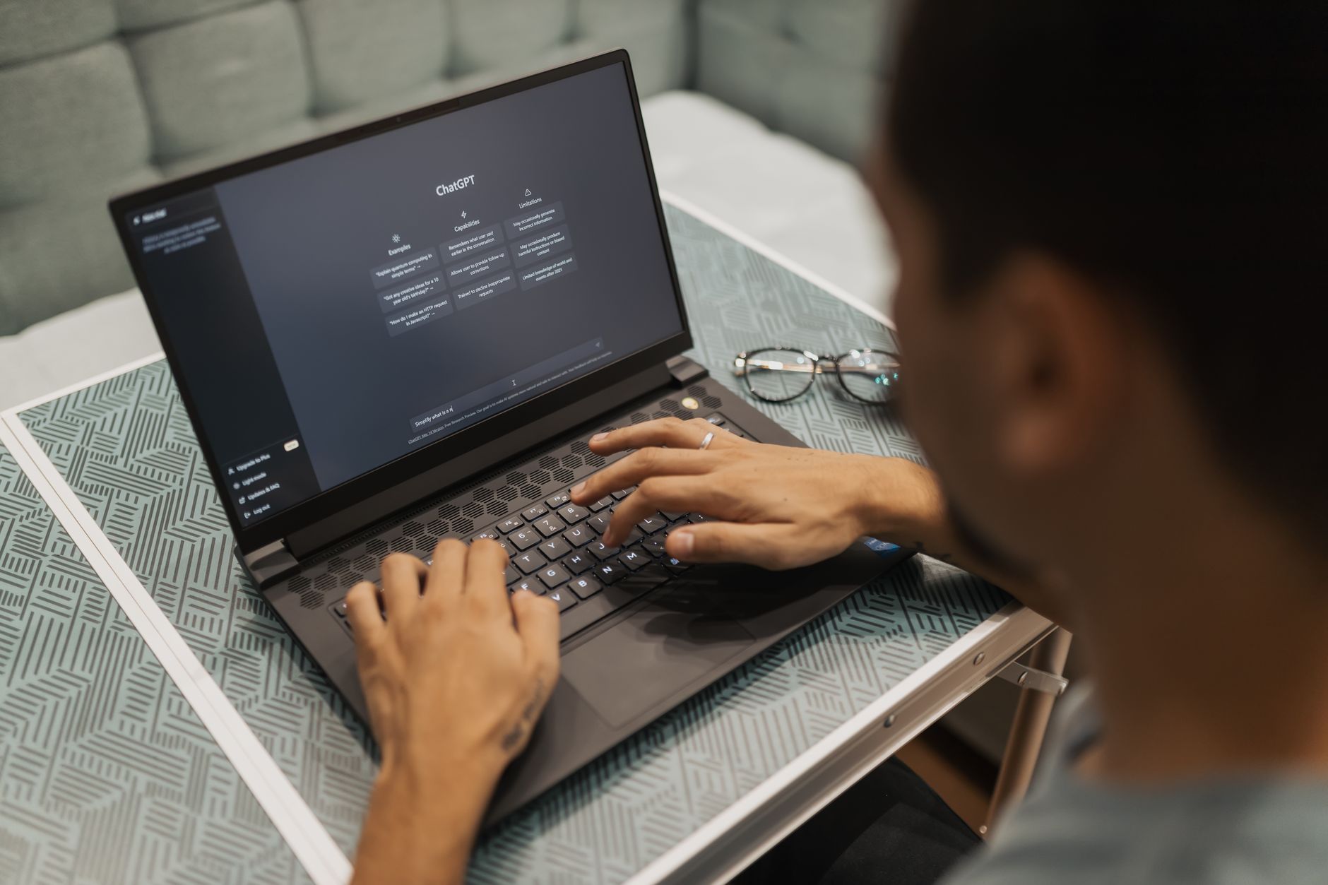 Product manager reviewing an AI task list for web accessibility fixes on a laptop