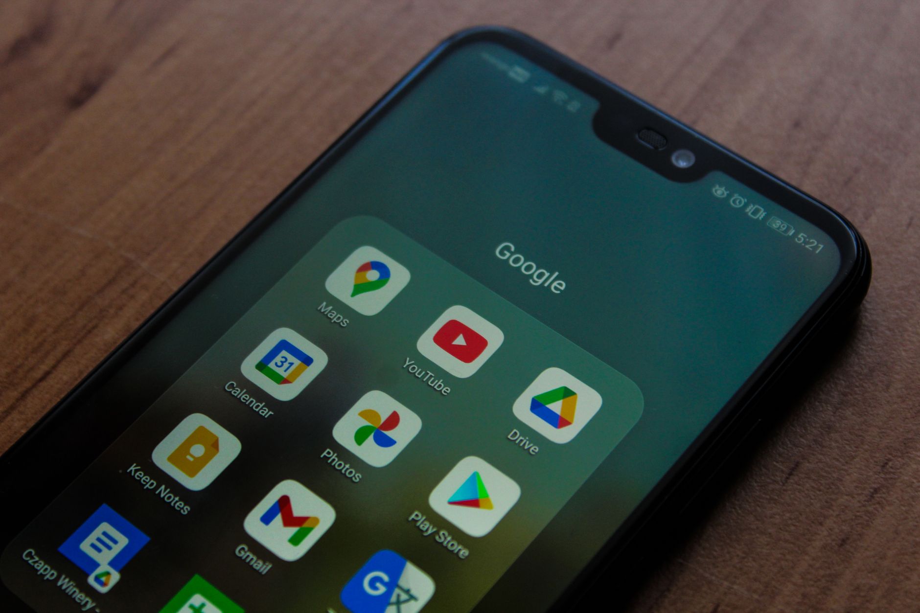 Developer reviewing Android accessibility issues on a smartphone with a checklist on a laptop