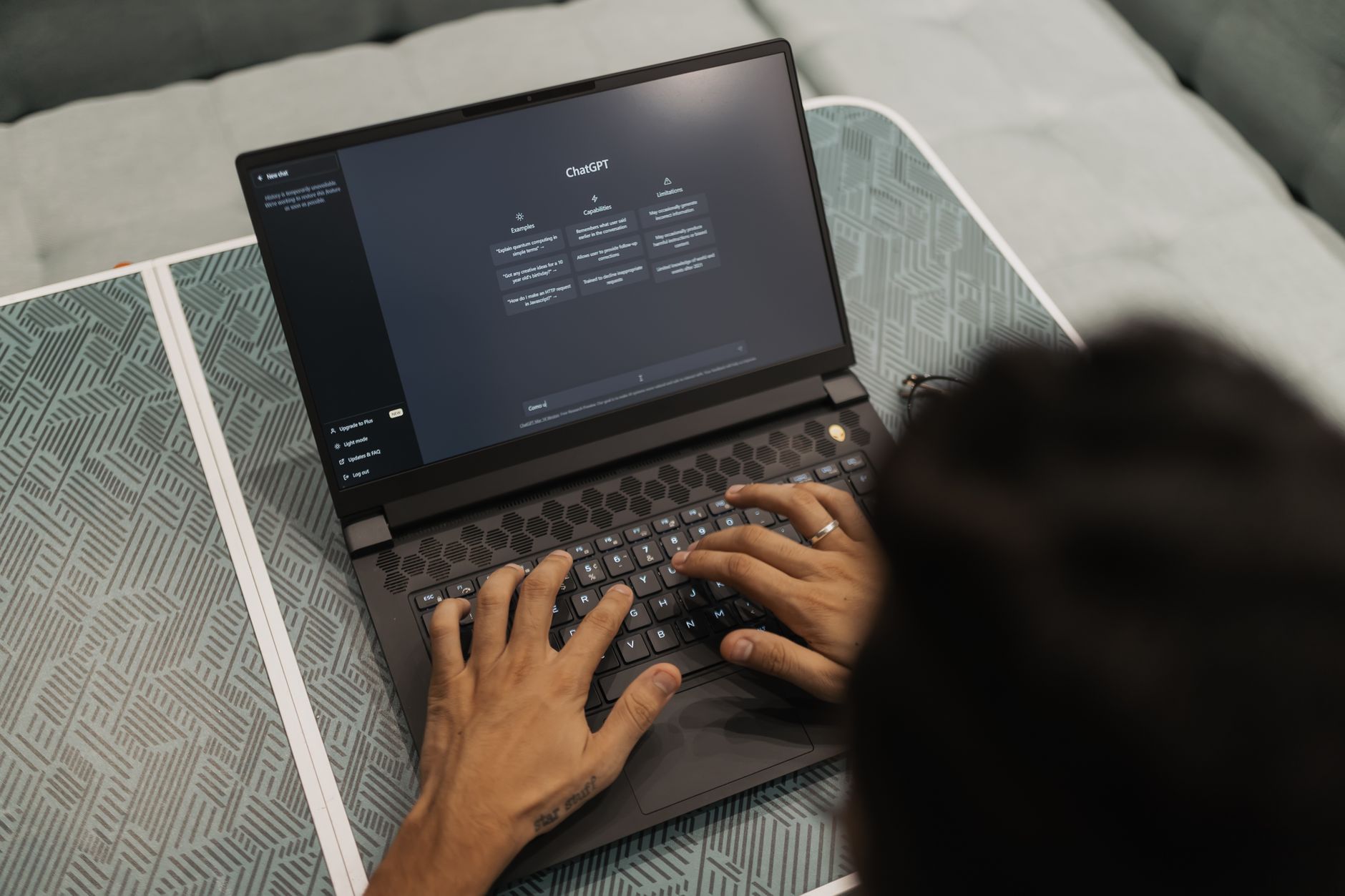 Accessibility specialist reviewing AI-generated accessibility audit results on a laptop