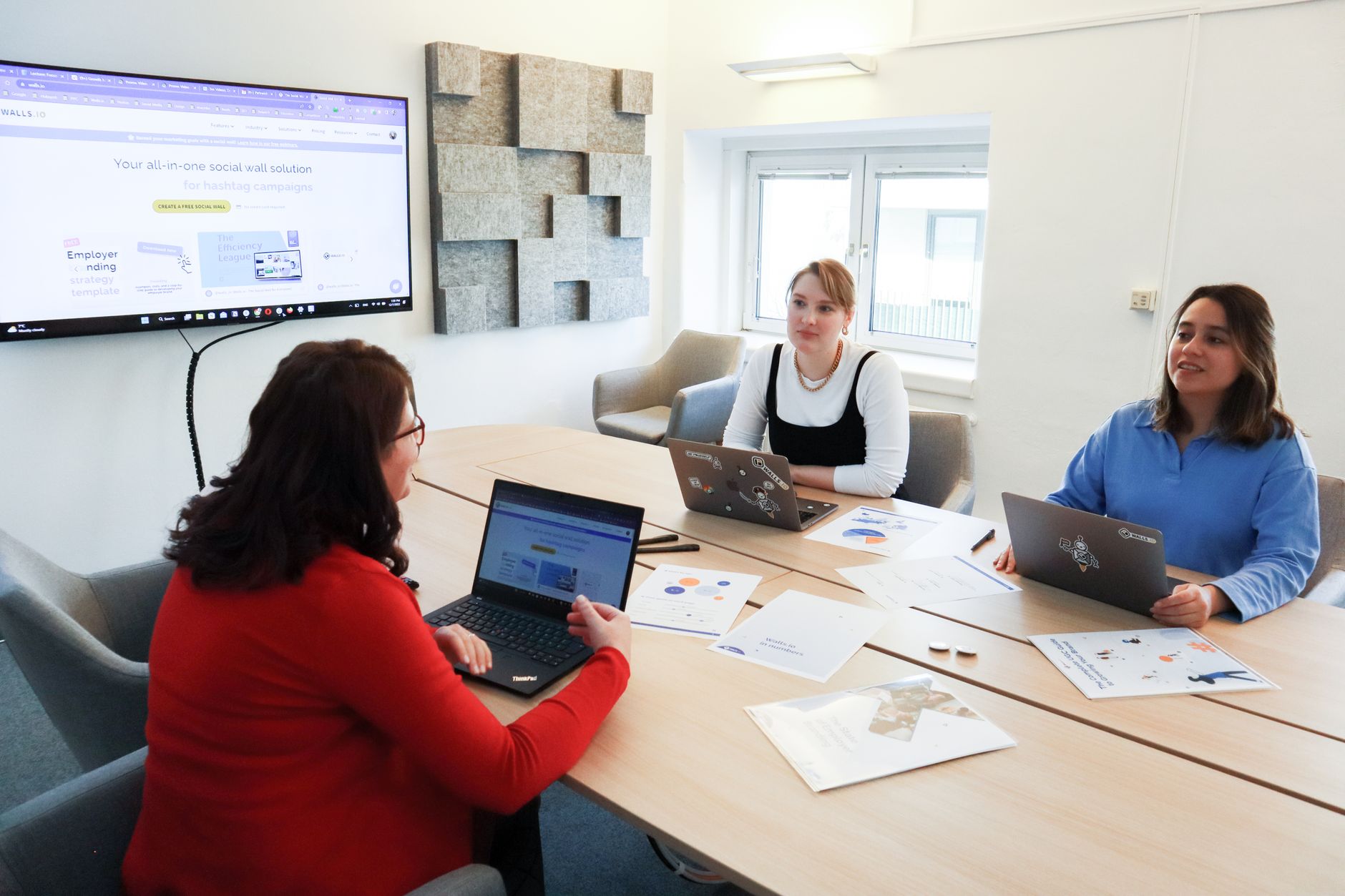 Attendees using laptops and assistive technology during a climate conference session