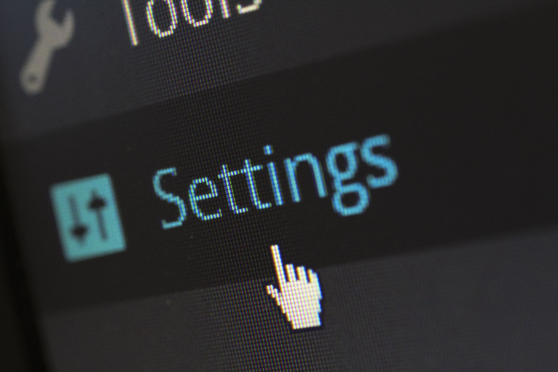 Person reviewing a cookie consent banner interface on a laptop with a compliance checklist beside it