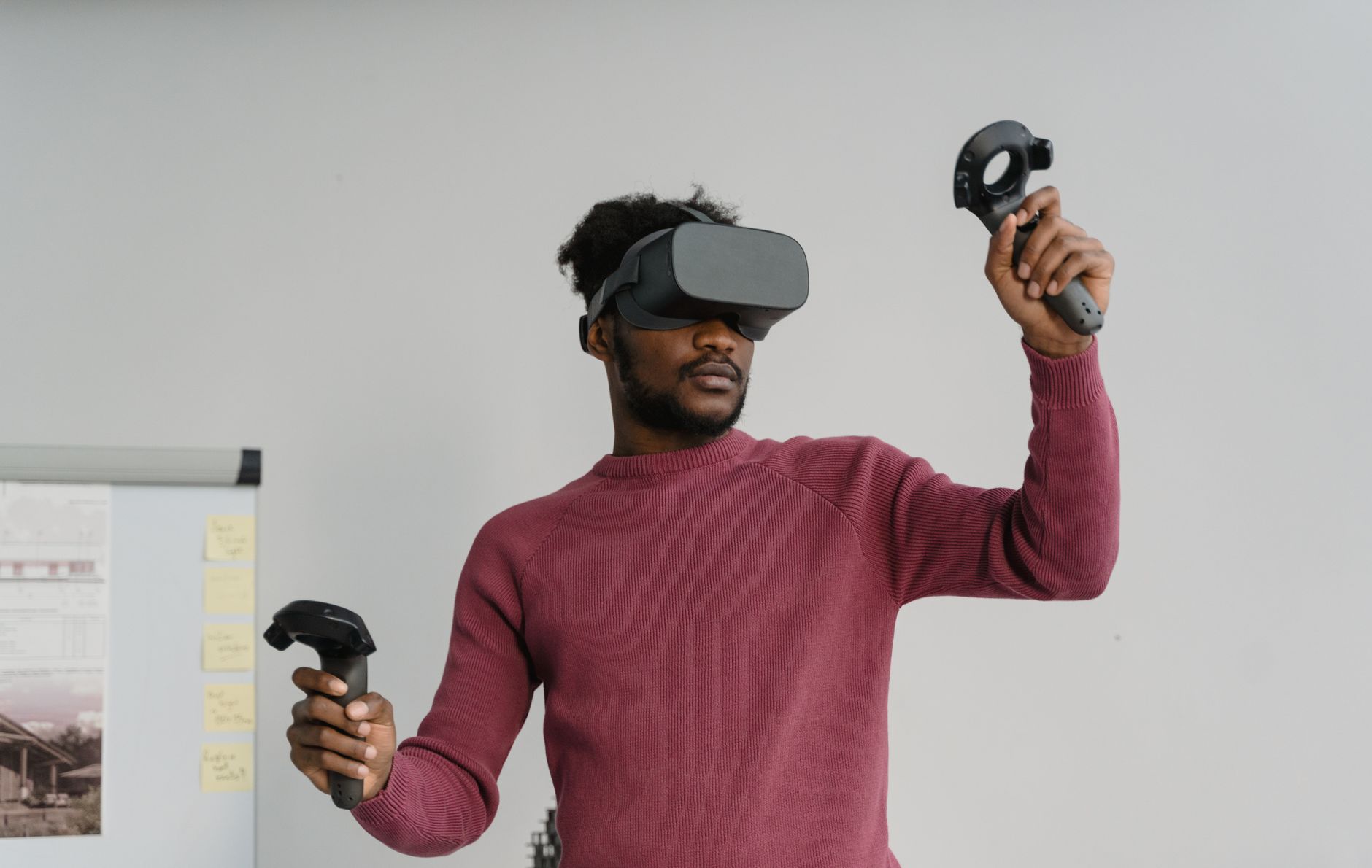 Designer testing accessibility flows across a headset, smart speaker, and mobile app