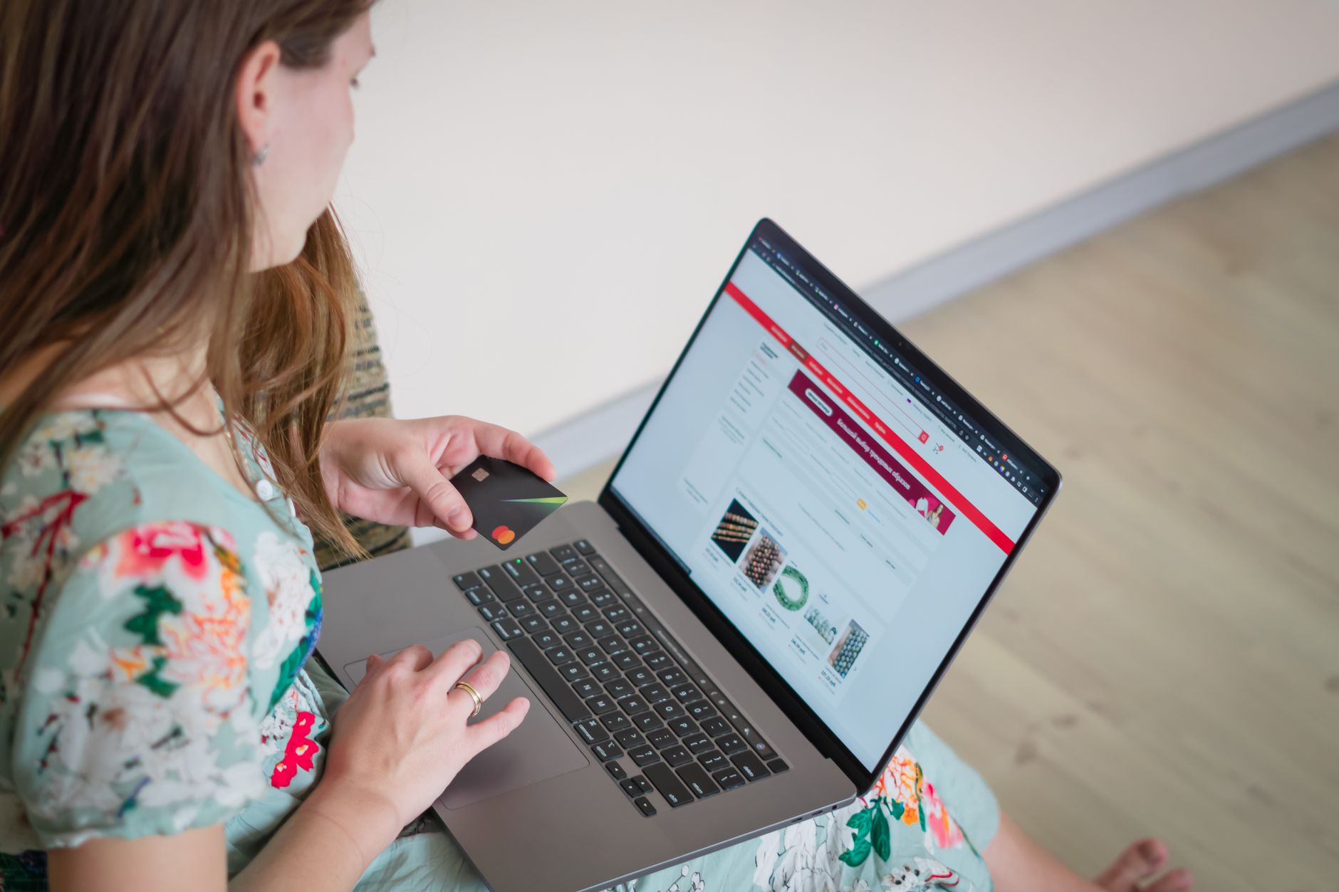 Shopper using a laptop to browse an accessible online store with a screen reader