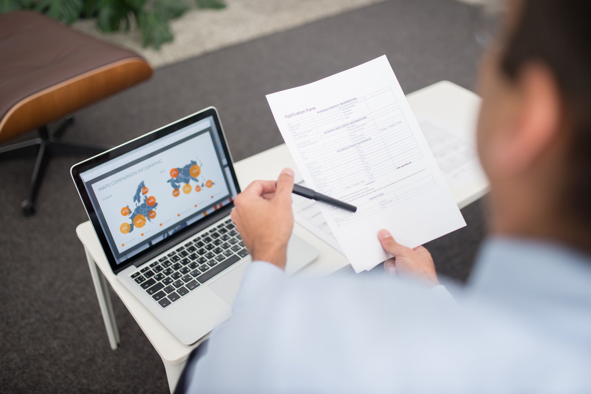 Public sector staff reviewing a government website accessibility checklist on a laptop
