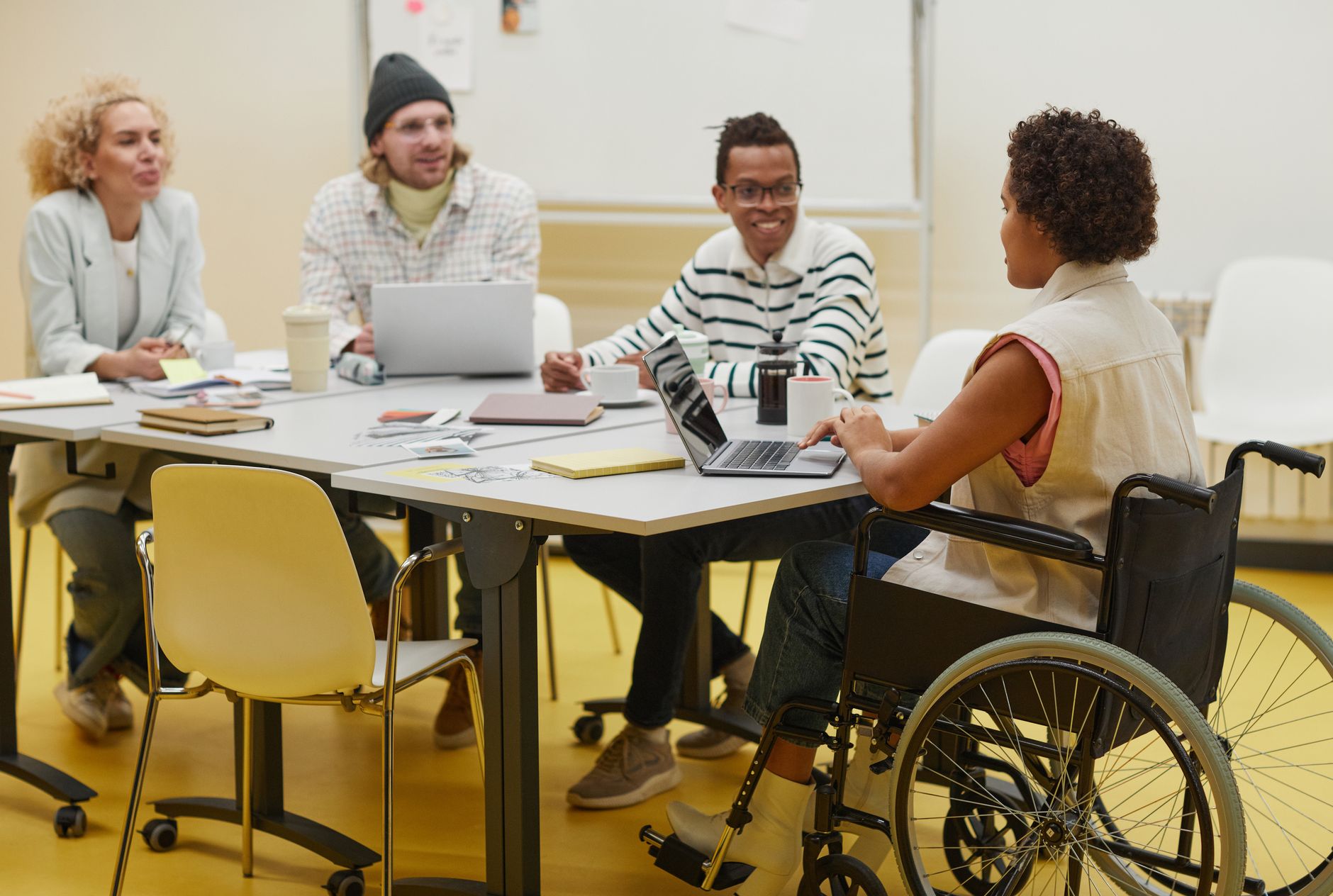 Public sector staff reviewing a government website accessibility checklist on a laptop