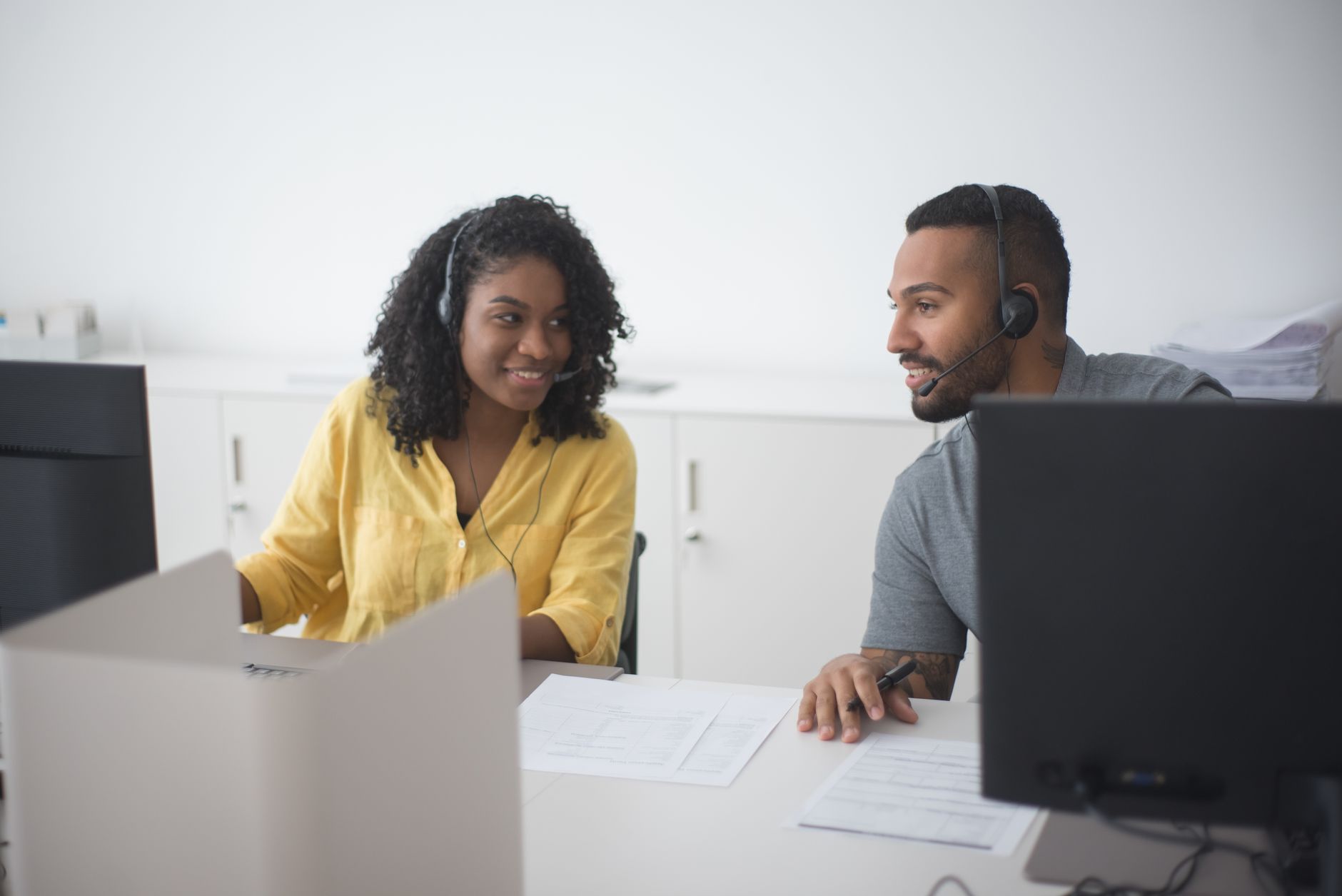 Insurance customer reviewing a policy on a laptop with accessibility settings visible