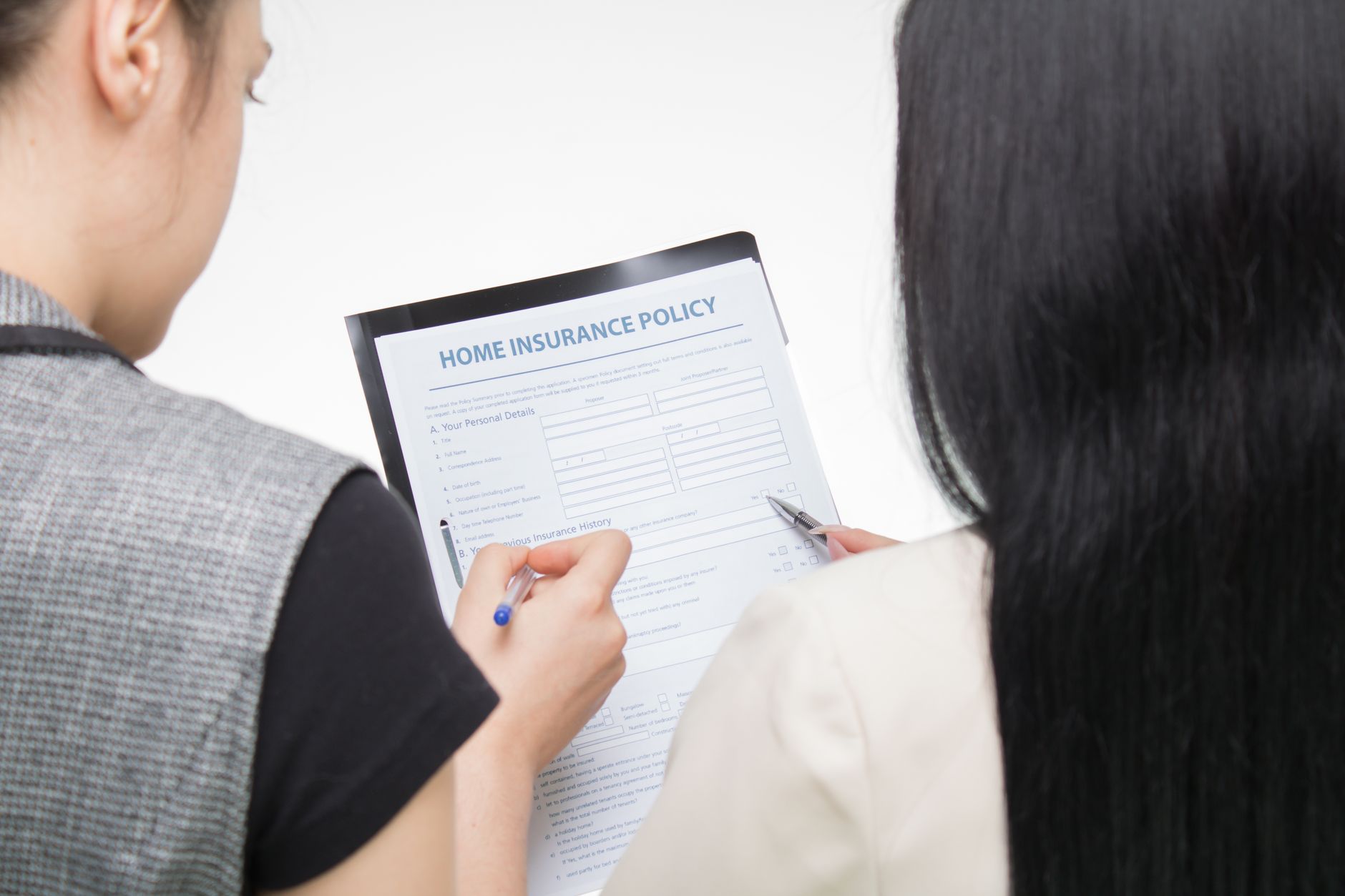 Insurance customer reviewing a policy on a laptop with accessibility settings visible