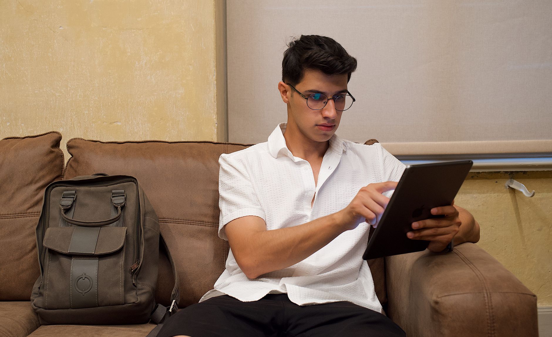 Job applicant using a laptop with assistive technology while completing an online application form