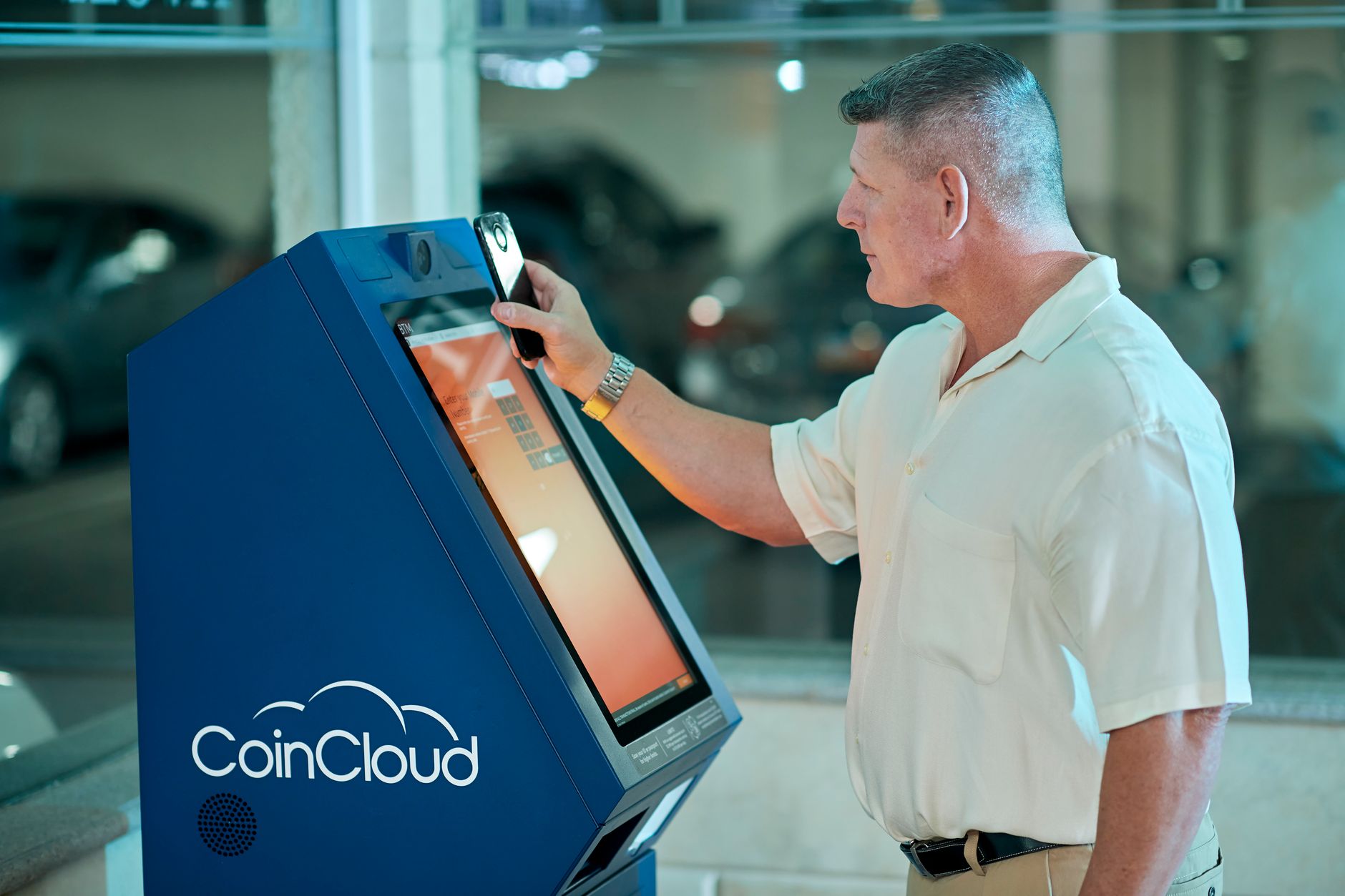 Retail customer using a smartphone in a store while browsing an accessible website interface