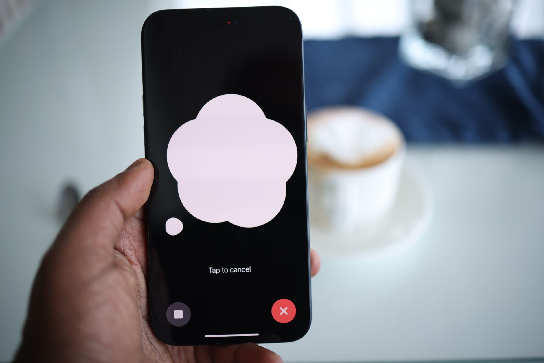 Customer using a smartphone with accessibility settings enabled while viewing a telecom account page