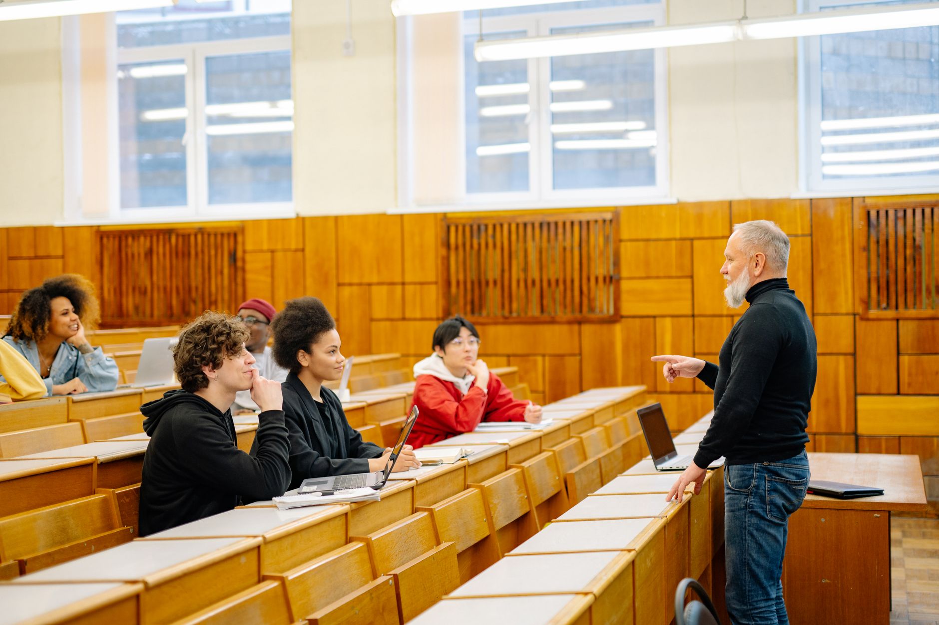 University student using a laptop with accessibility settings enabled in a campus library