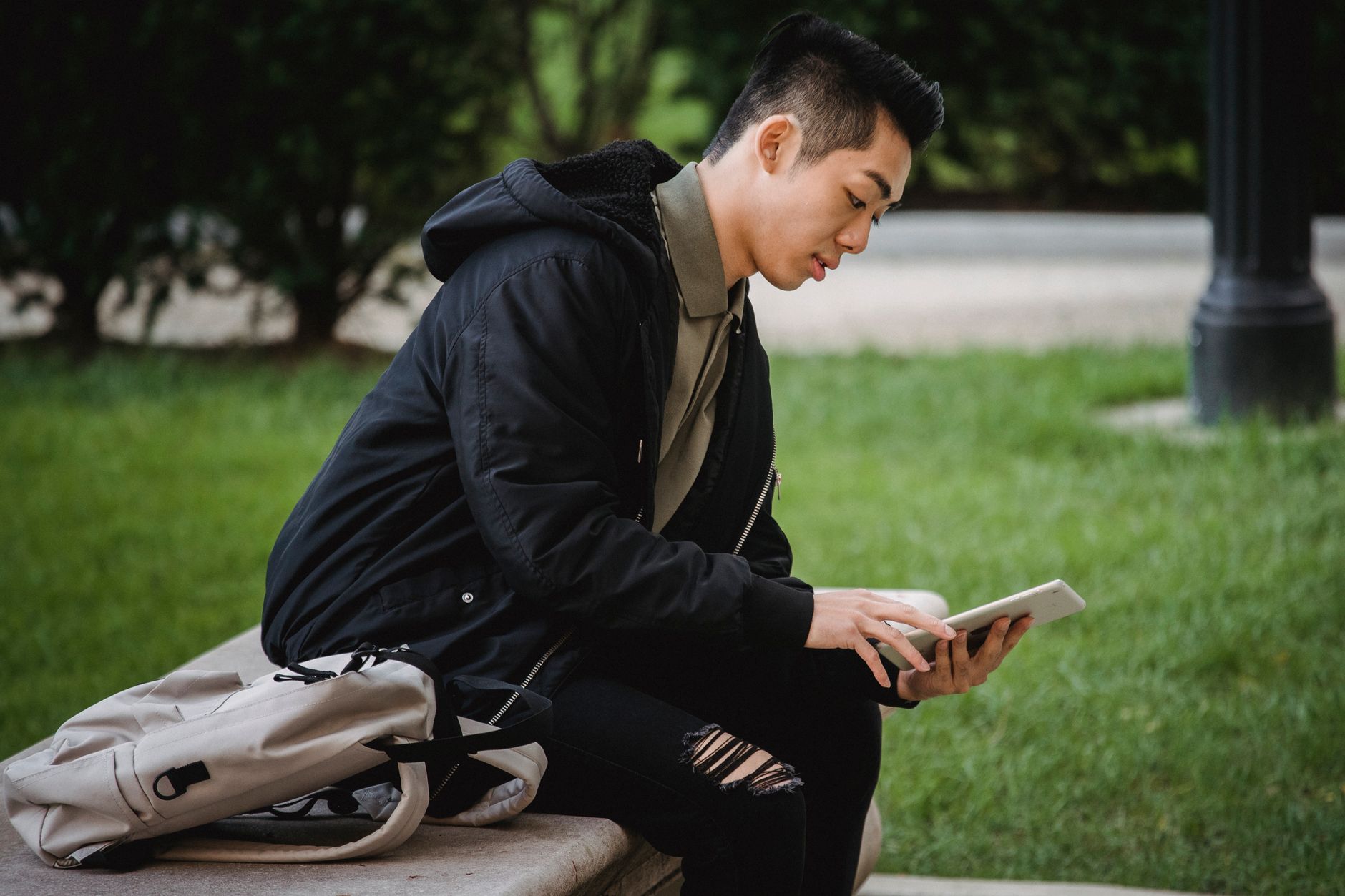 University student using a laptop with accessibility settings enabled in a campus library