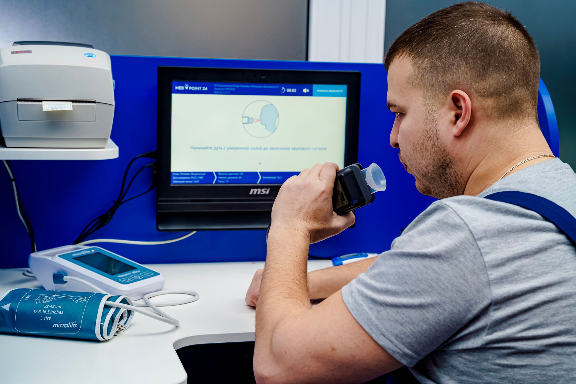 Procurement team reviewing a VPAT accessibility report on a laptop in a conference room