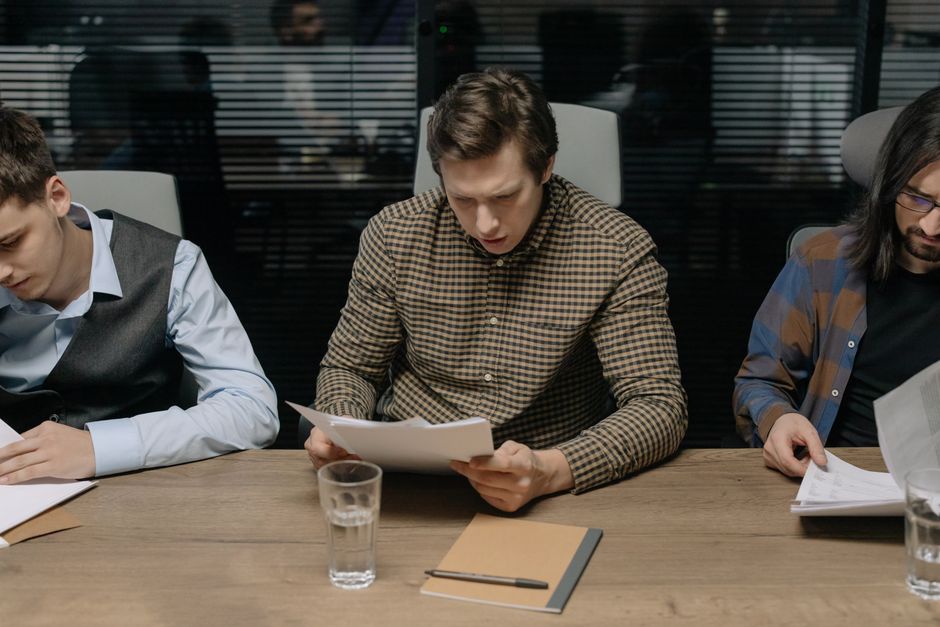 Website privacy team reviewing a cookie consent banner design on a laptop