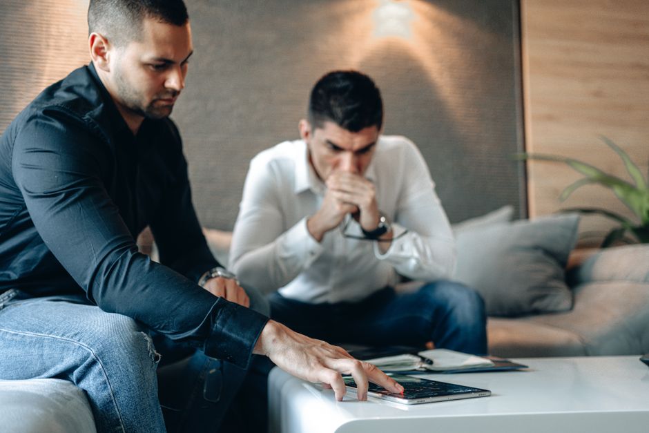 Privacy professional reviewing website cookie scanner results on a laptop