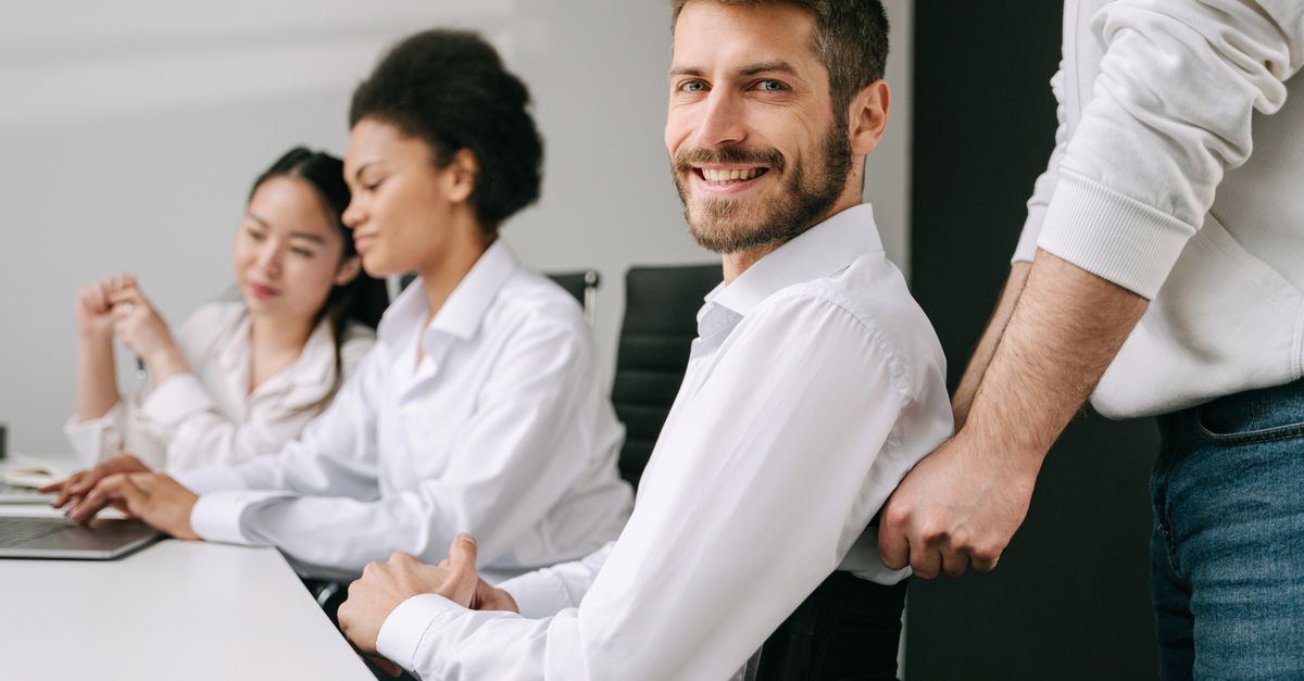 Digital compliance team reviewing website accessibility results on office screens