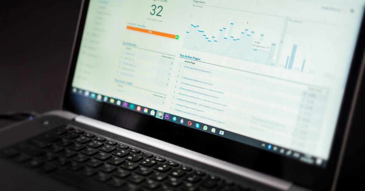 Team reviewing technical SEO monitoring dashboard on a laptop