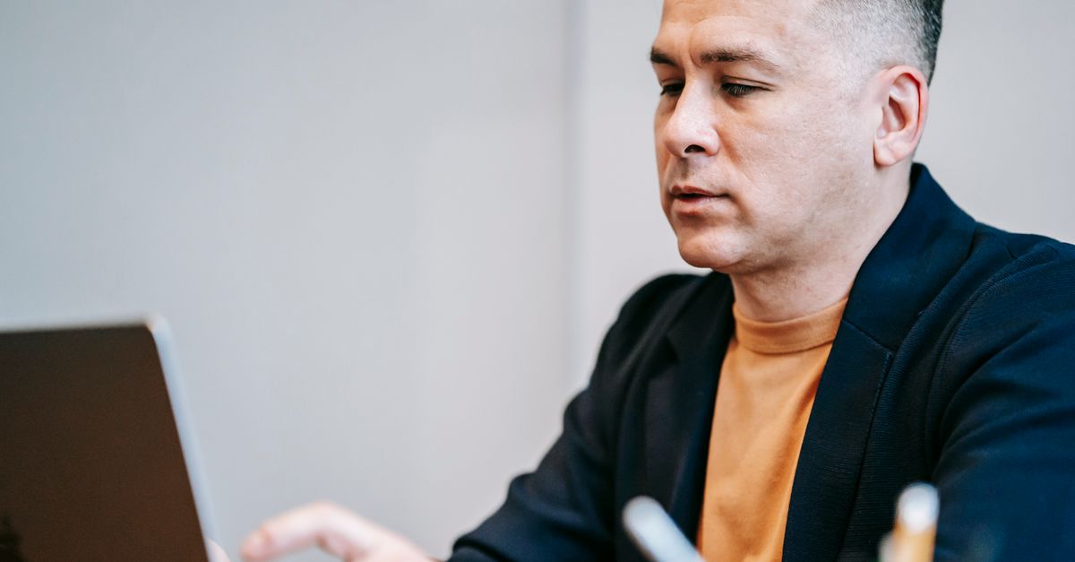 Designer using a Figma accessibility plugin during a WCAG 2.2 design review