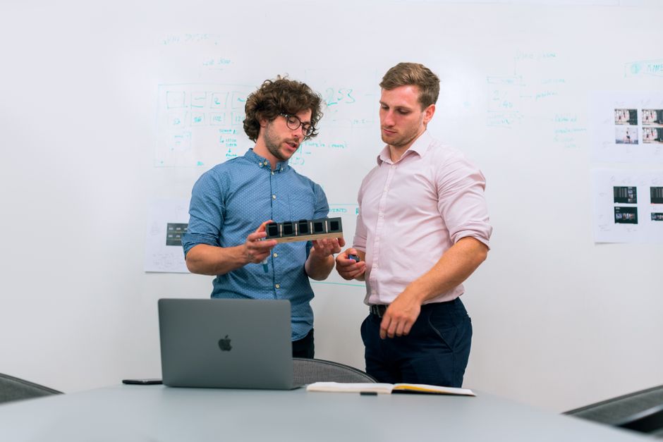 Digital team reviewing website checkout accessibility and AI agent user flow on a laptop