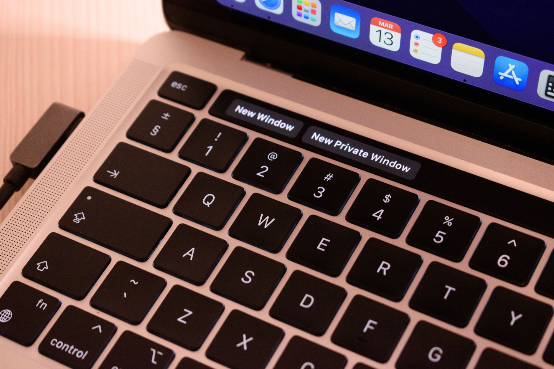 Person adjusting website accessibility settings on a laptop with a visible accessibility widget panel