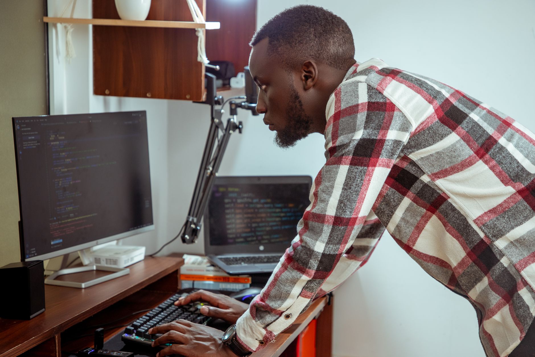Accessibility specialist reviewing WCAG issues on a laptop with a website audit checklist