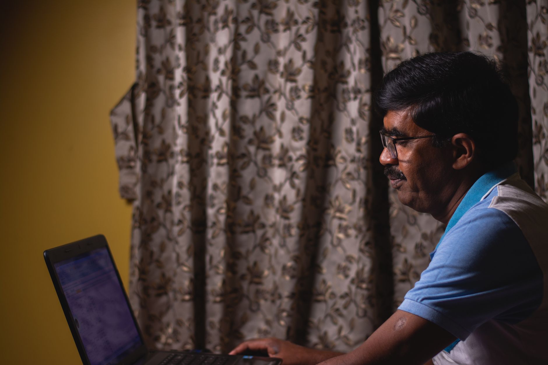 Business professional reviewing a website accessibility compliance report on a laptop with legal documents nearby