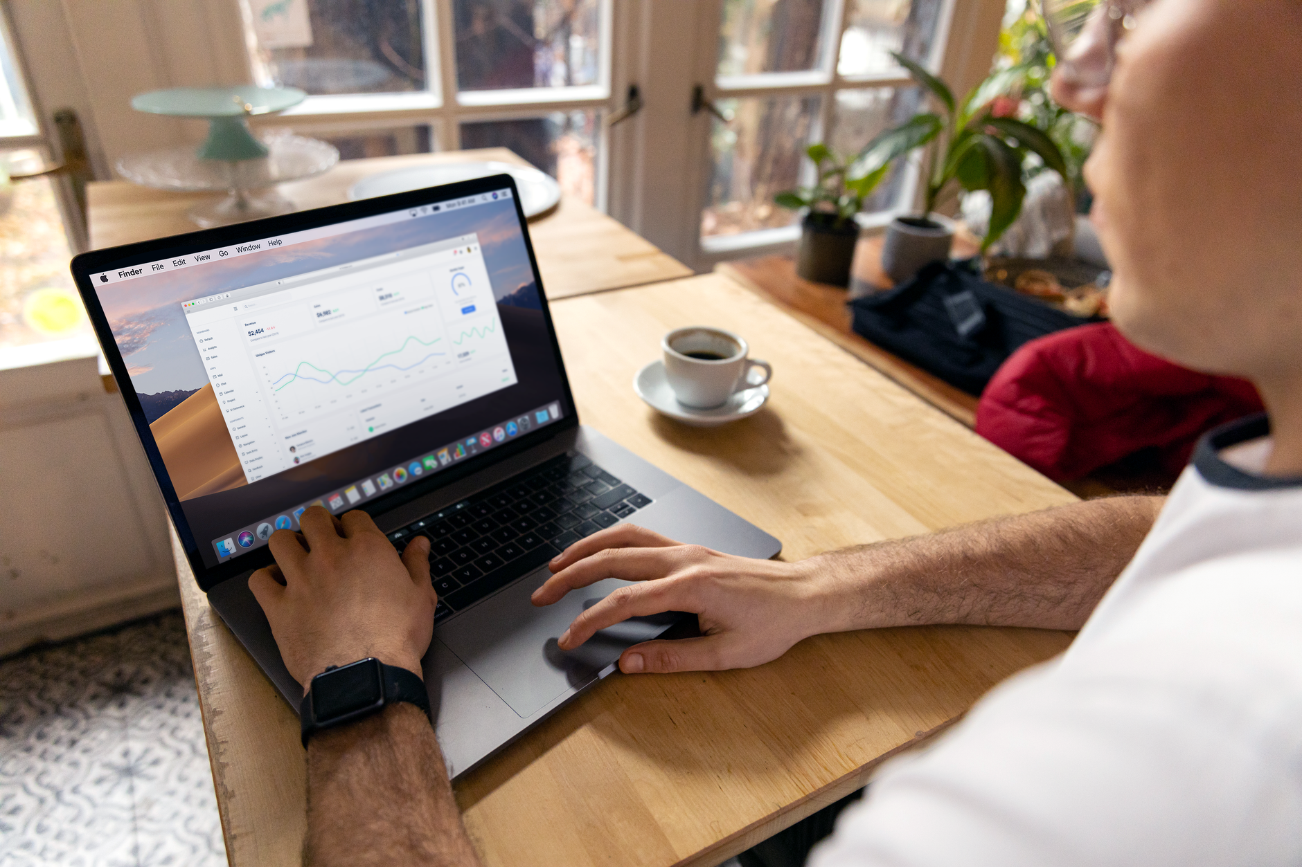 Person reviewing website consent settings and analytics dashboard on a laptop