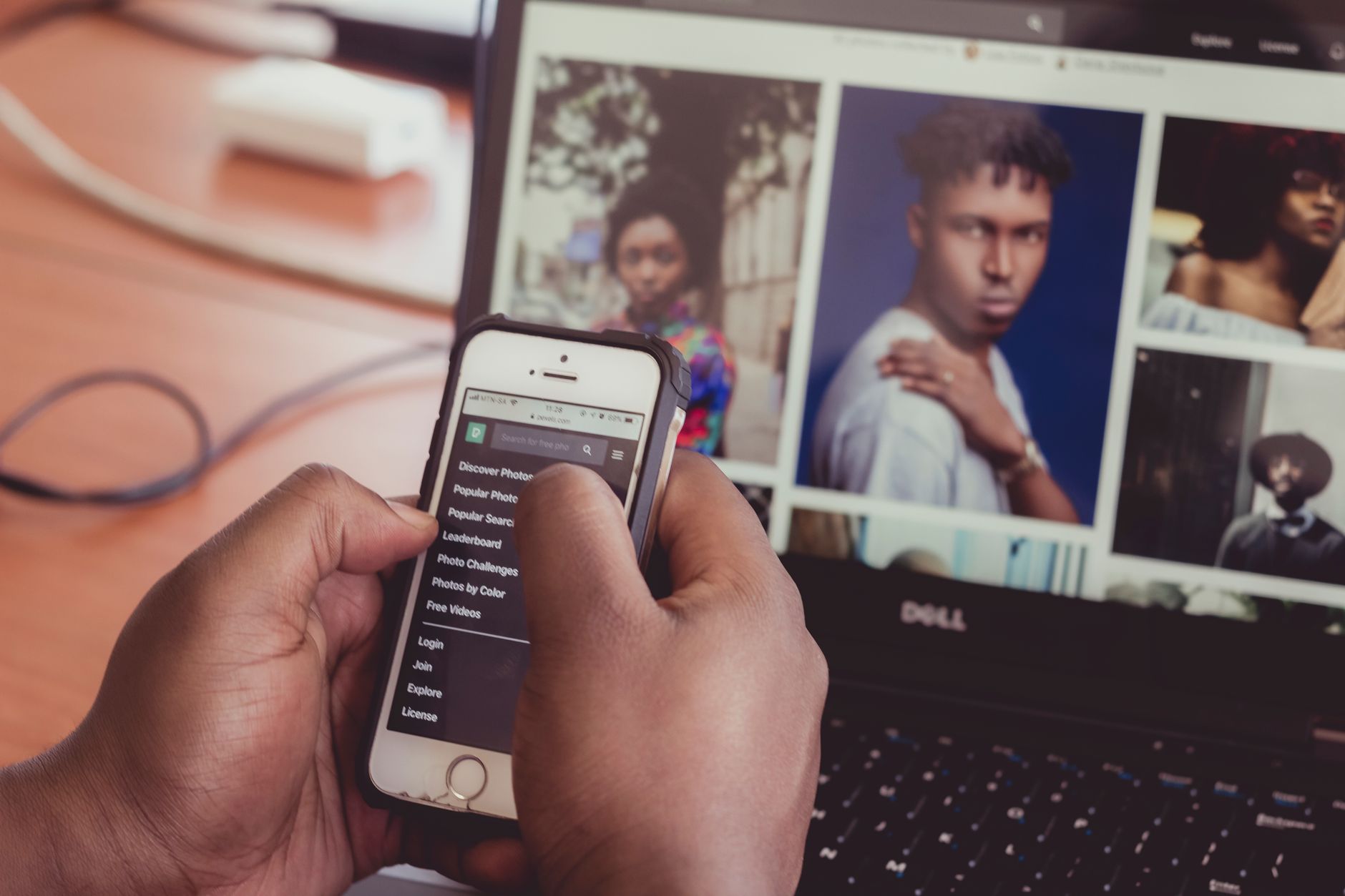 Person using a smartphone photo gallery app with a screen reader enabled