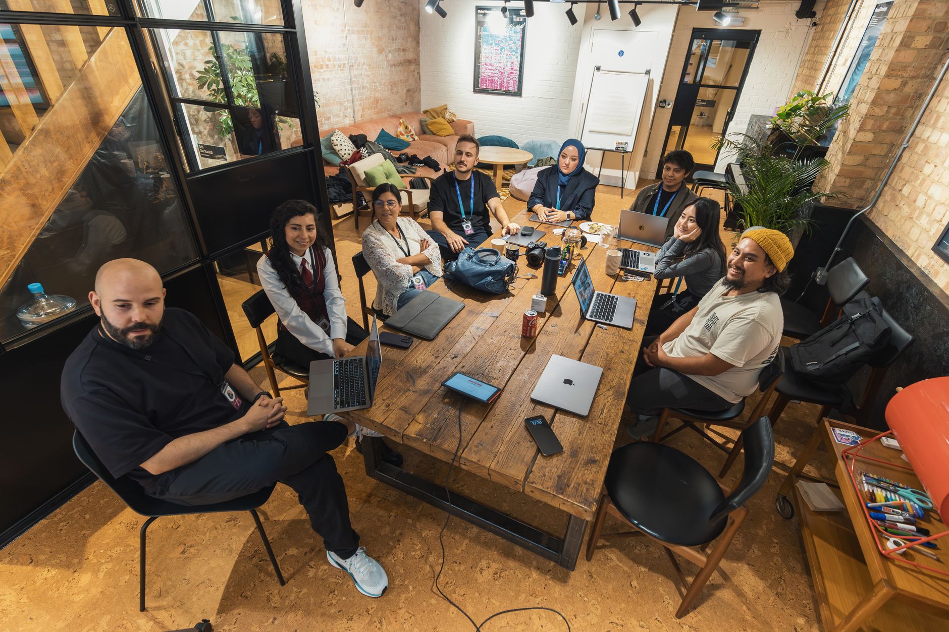 Government digital team reviewing an accessibility checklist on laptops in a meeting room