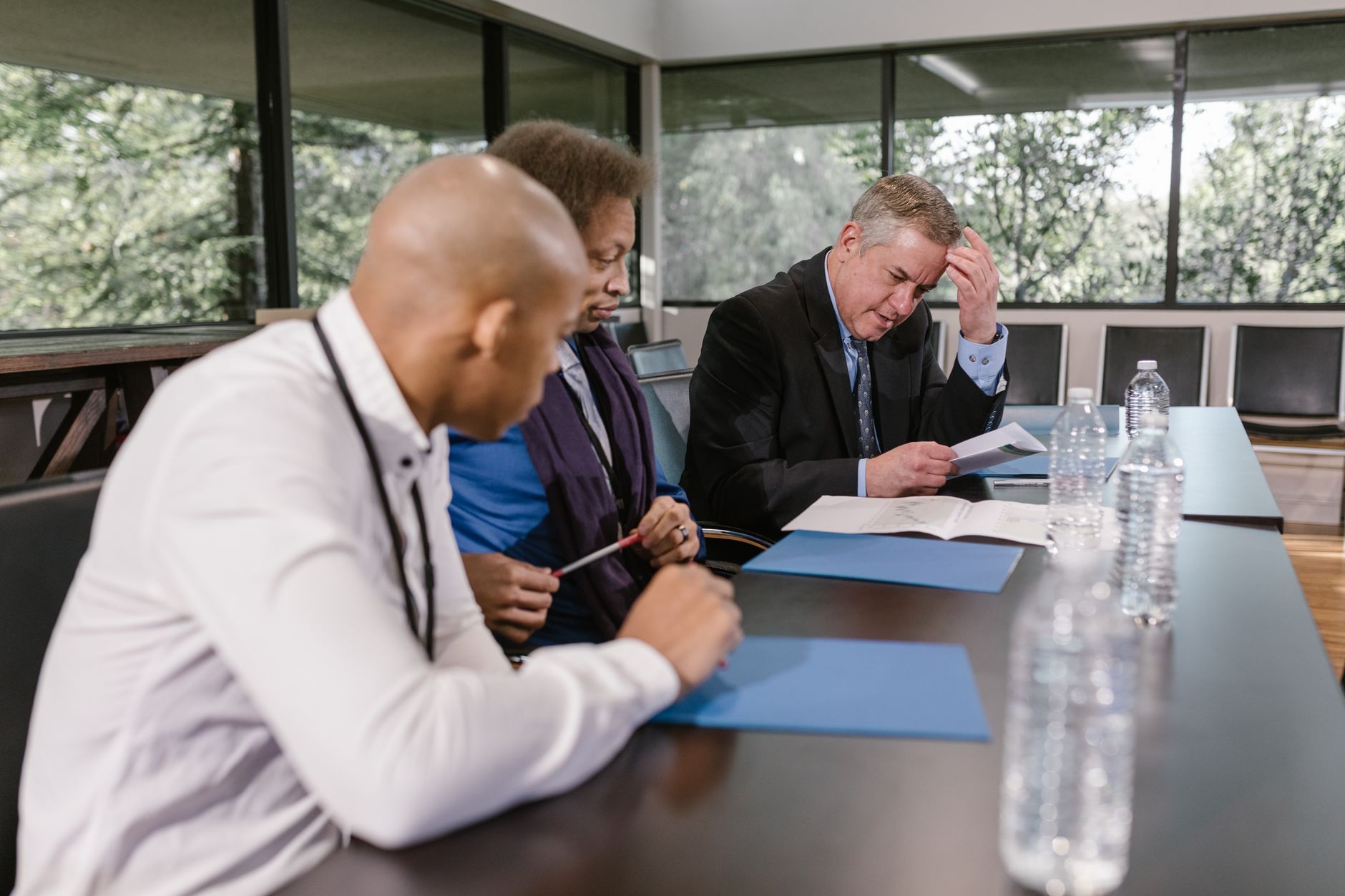 Accessibility specialist reviewing an AI-generated VPAT draft on a laptop with compliance notes