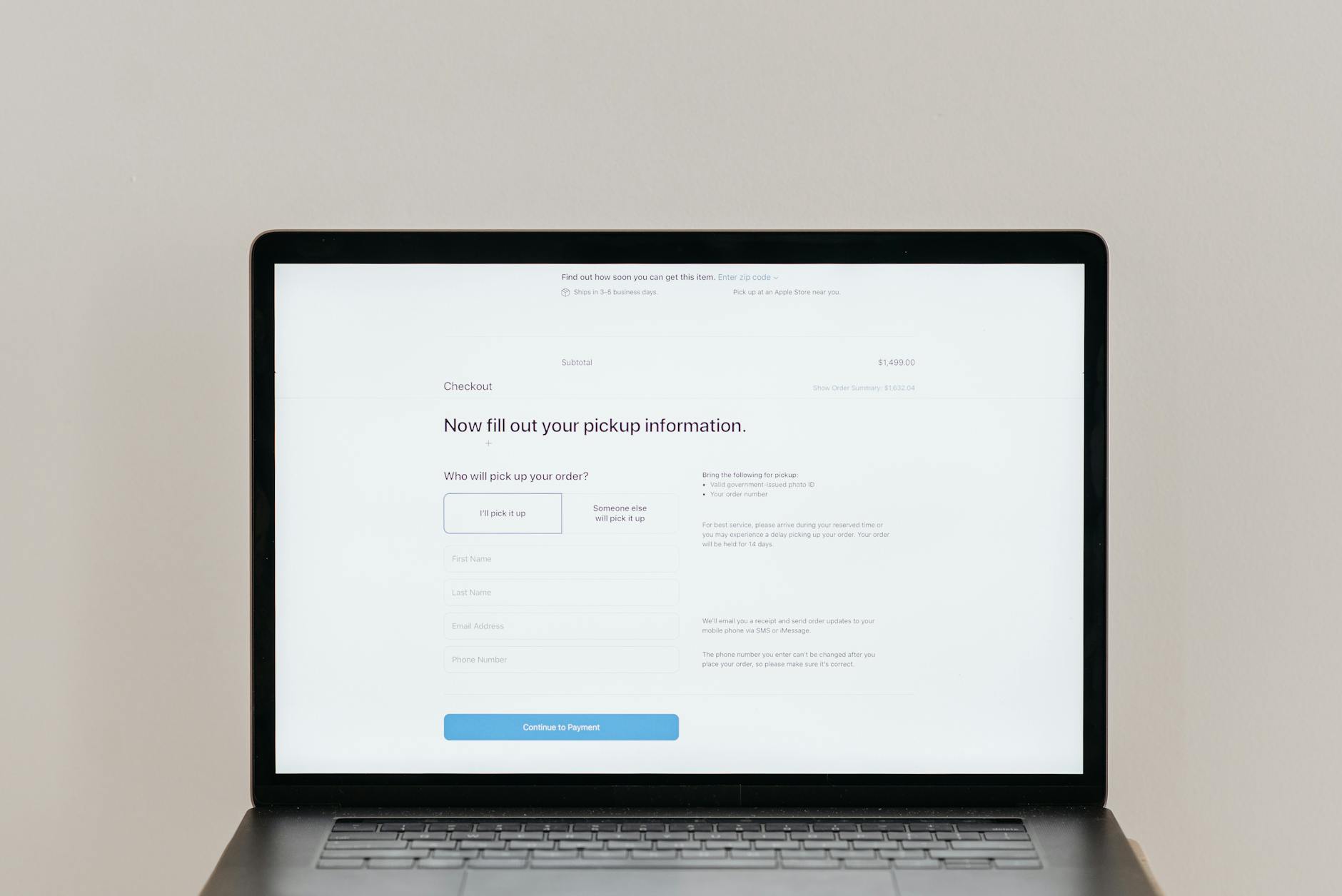 Person reviewing a PDF accessibility checklist on a laptop with notes and a document open