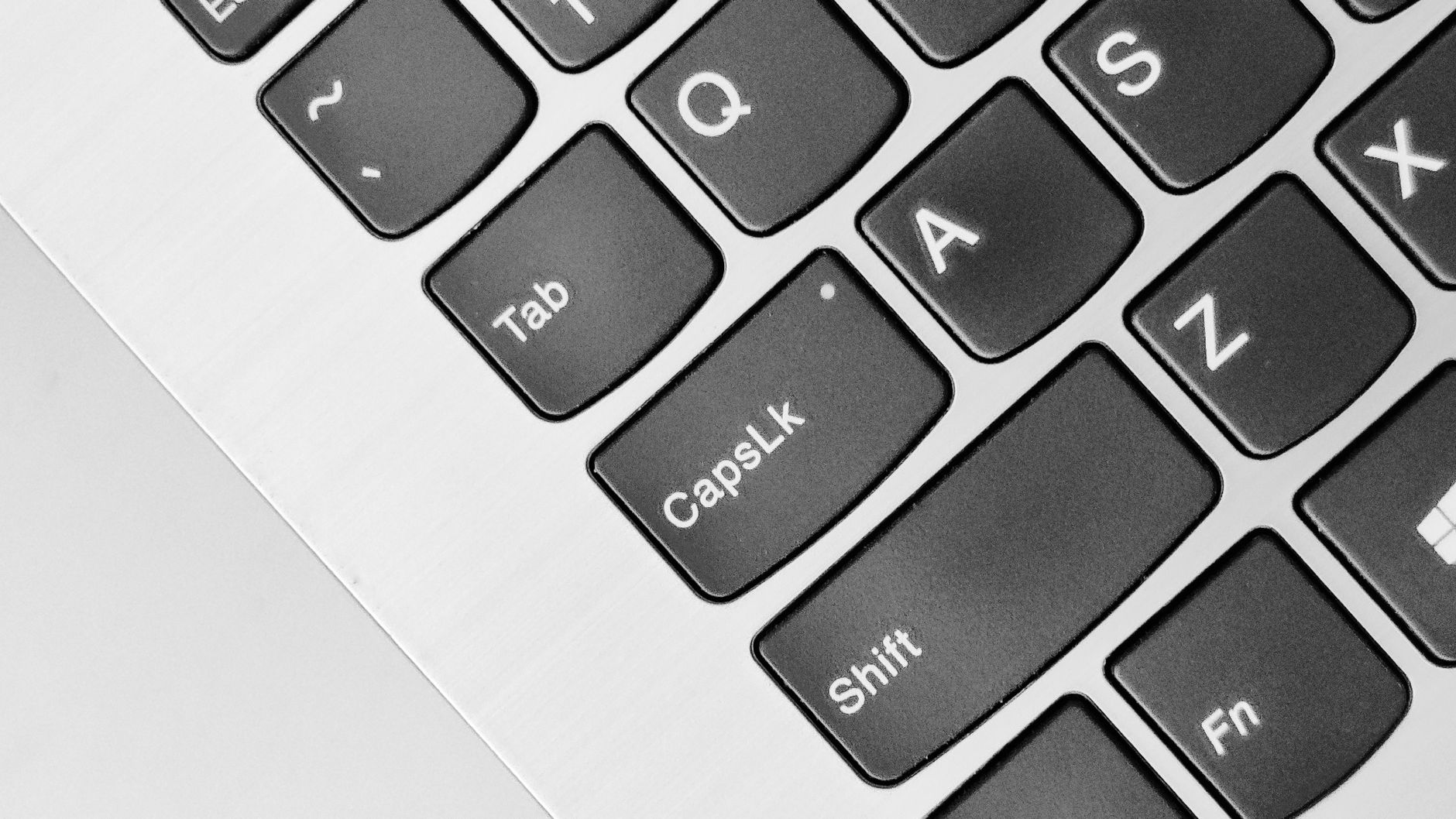 Person using a laptop with a cookie consent banner dialog visible, illustrating accessible consent design