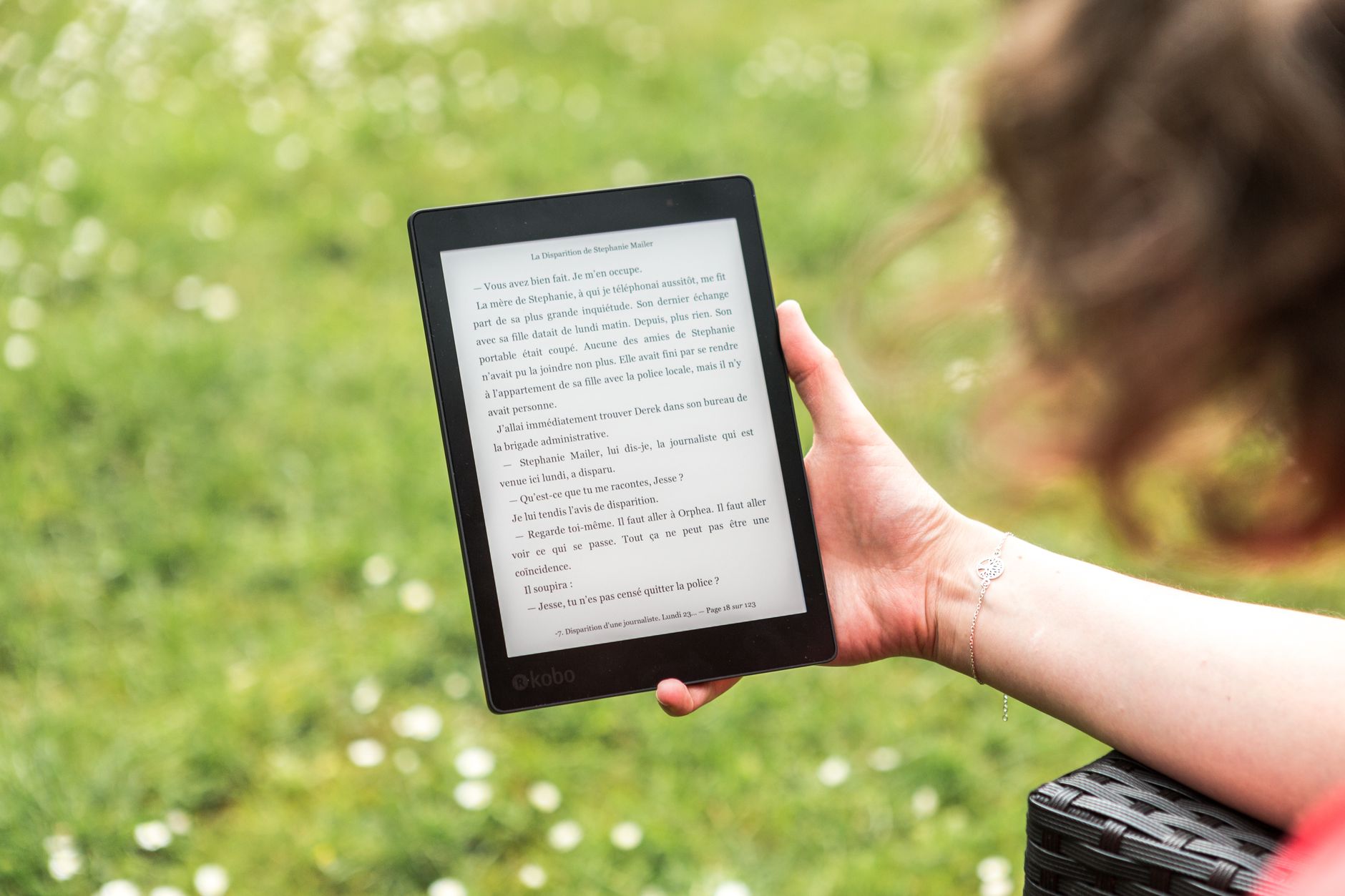 Person using a laptop with a cookie consent banner dialog visible, illustrating accessible consent design