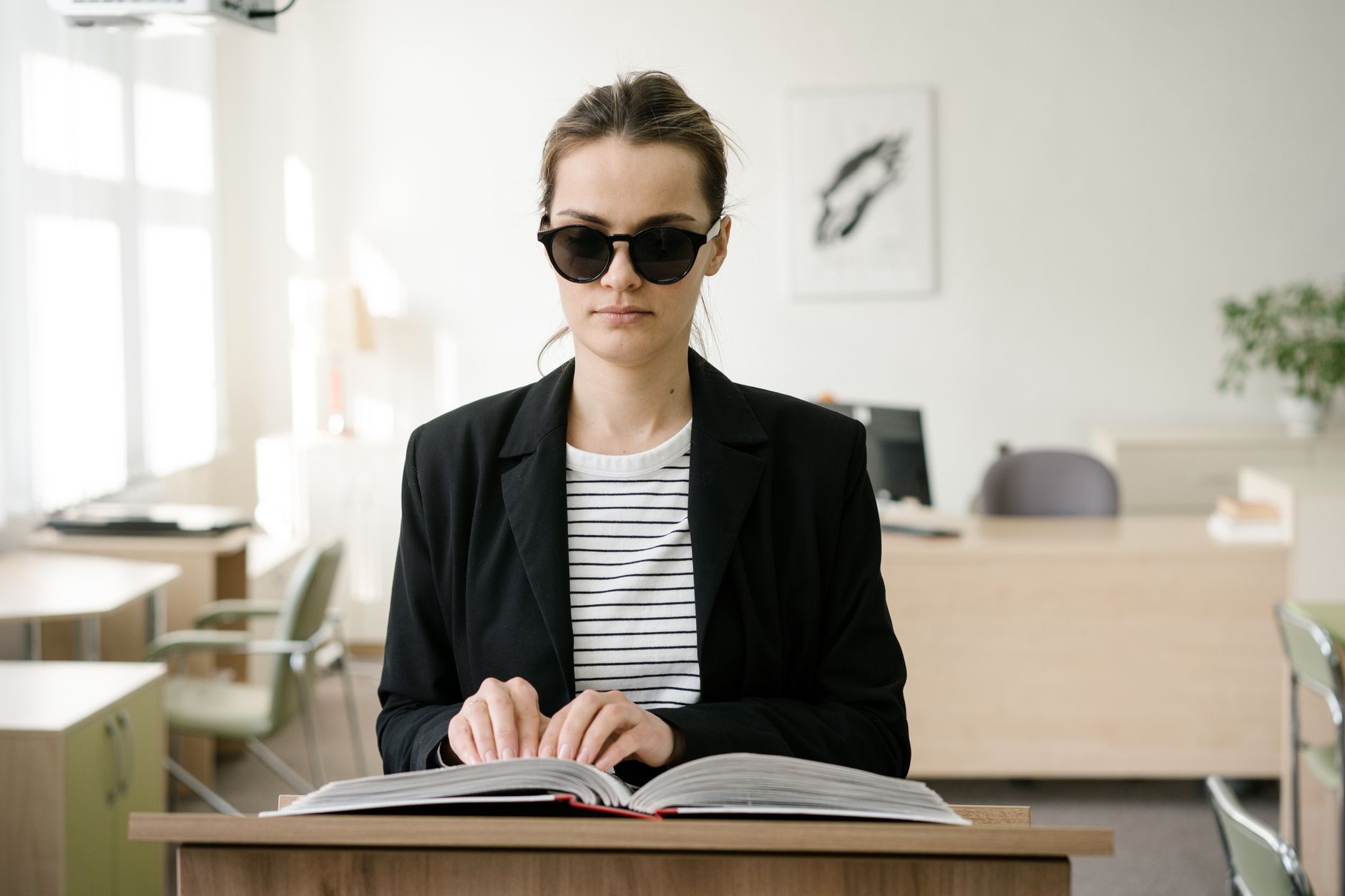 Person reviewing a website accessibility checklist on a laptop