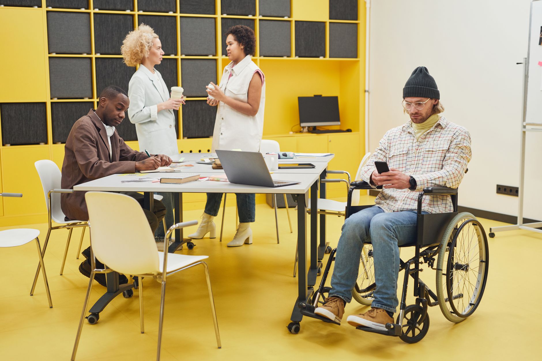 Person using a laptop on a government services website with accessibility settings visible