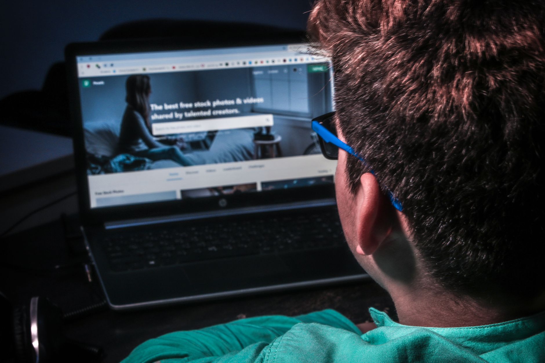 Person using a laptop on a government services website with accessibility settings visible