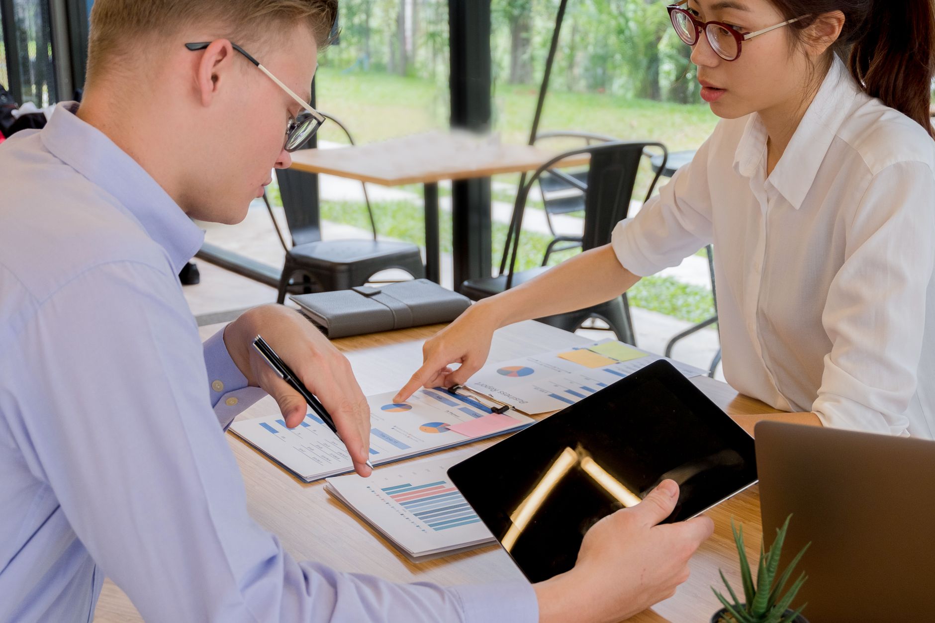 Accessibility specialist reviewing a mobile app with a screen reader and checklist