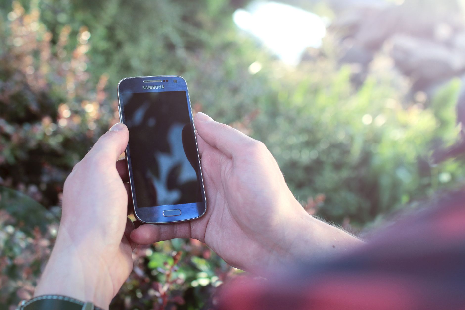 Accessibility specialist reviewing a mobile app with a screen reader and checklist