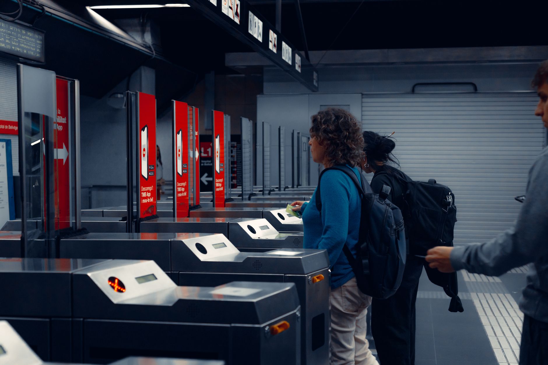 A person using a smartphone movie ticket app with accessibility options visible on screen
