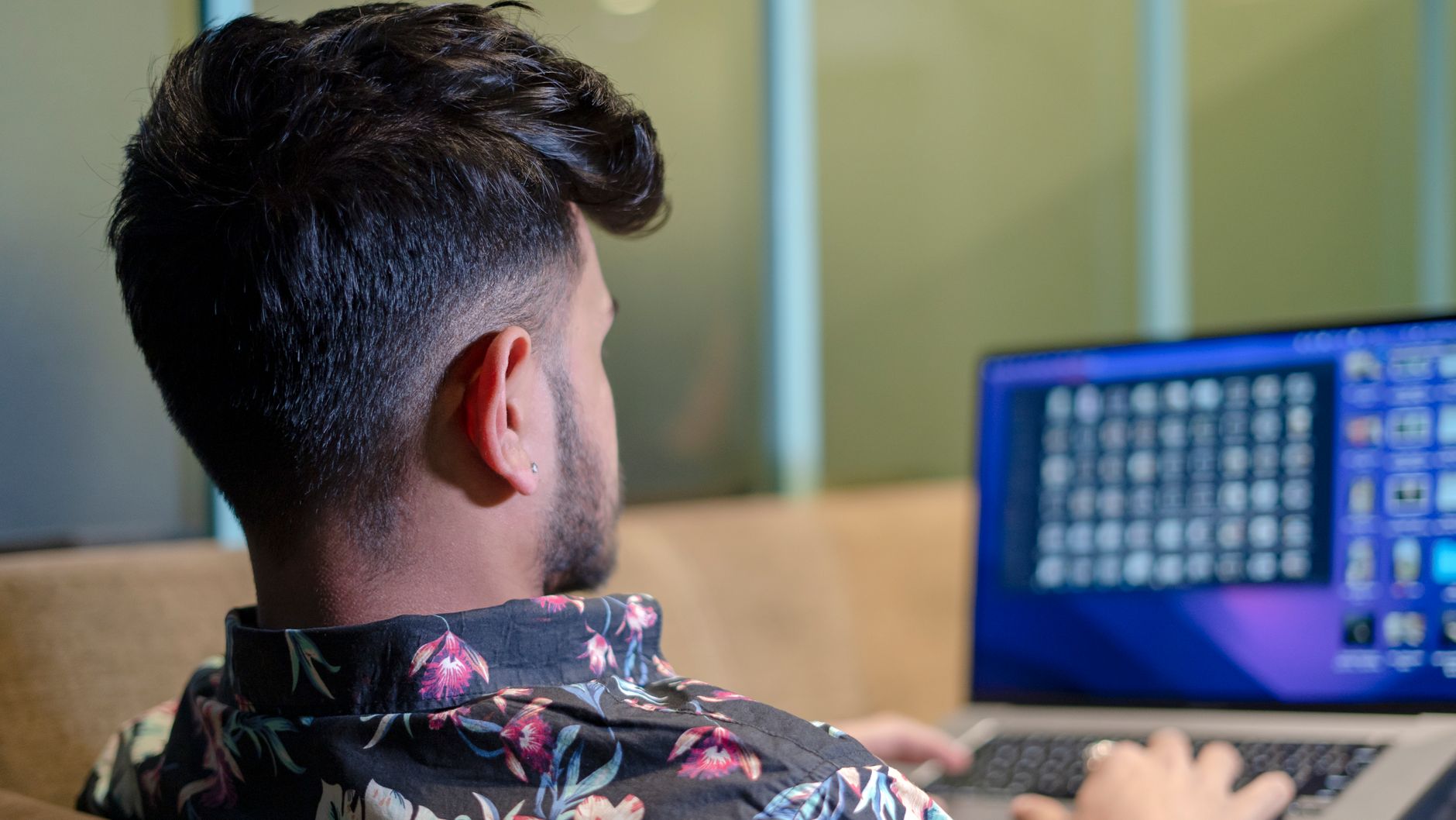 Person reviewing multilingual cookie consent settings on a laptop with language options visible