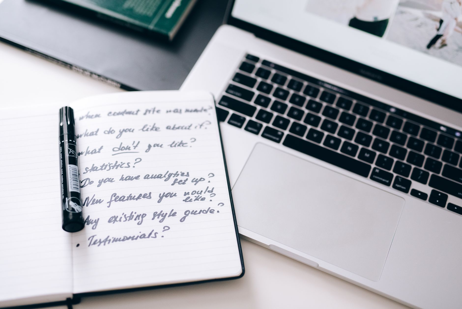 Content strategist reviewing accessibility-focused niche content outlines on a laptop