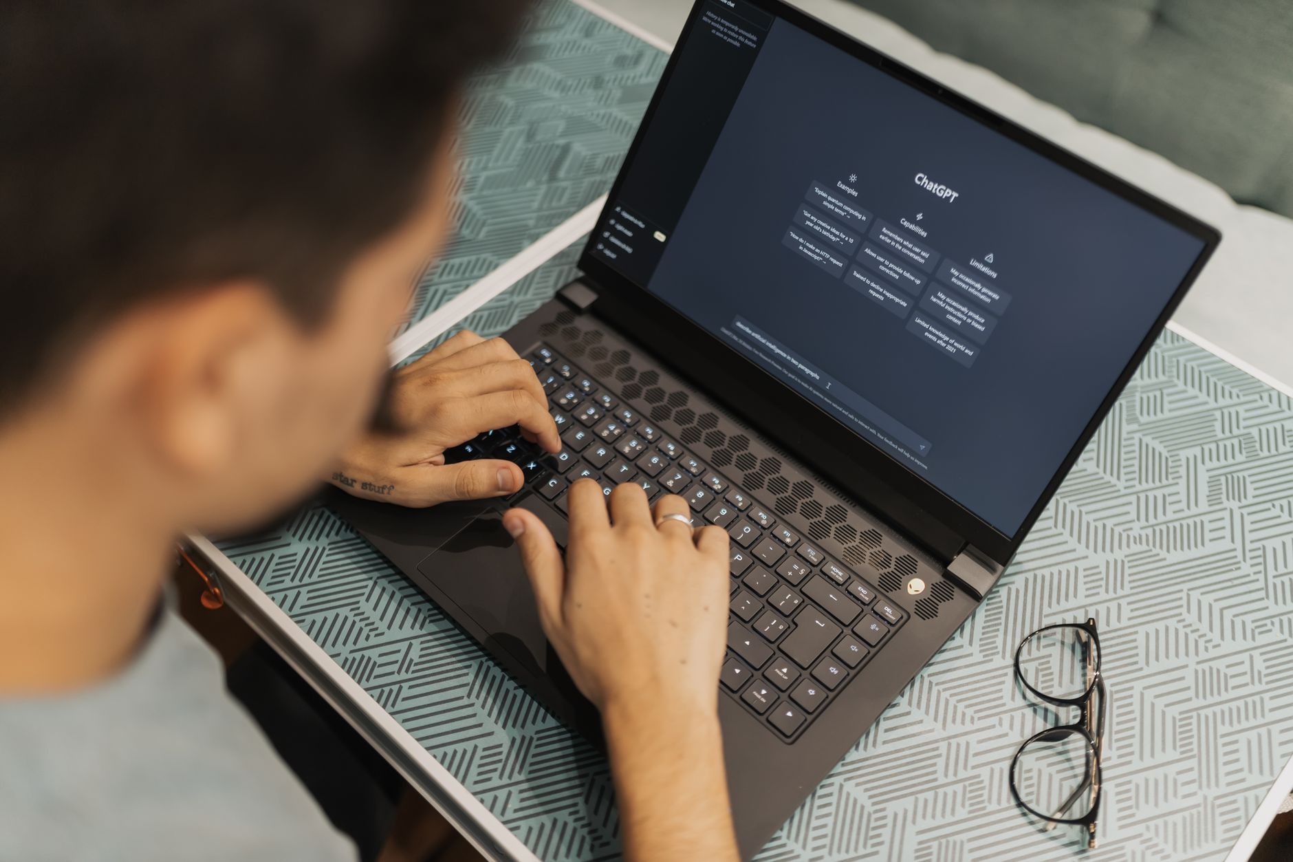 Person using a laptop with accessibility settings open in a modern Romanian office environment