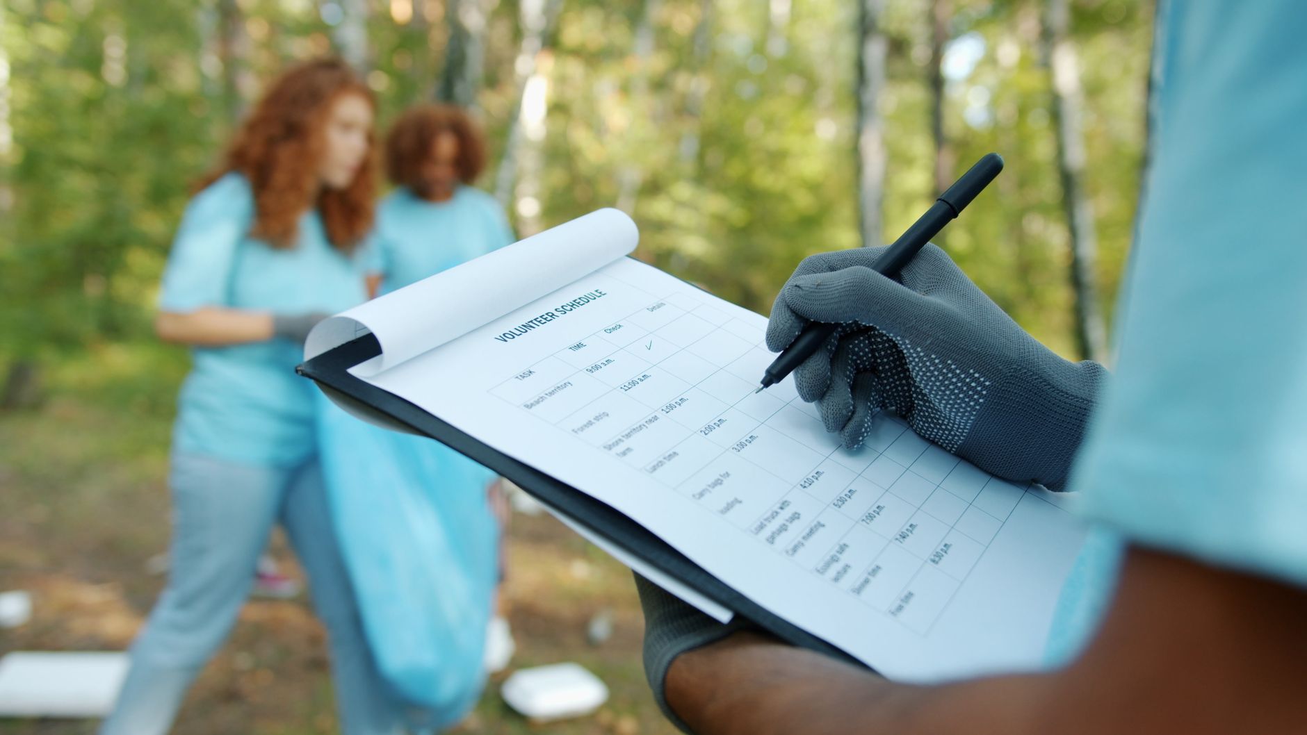 Designer reviewing accessibility annotations and color contrast in a Figma interface on a laptop