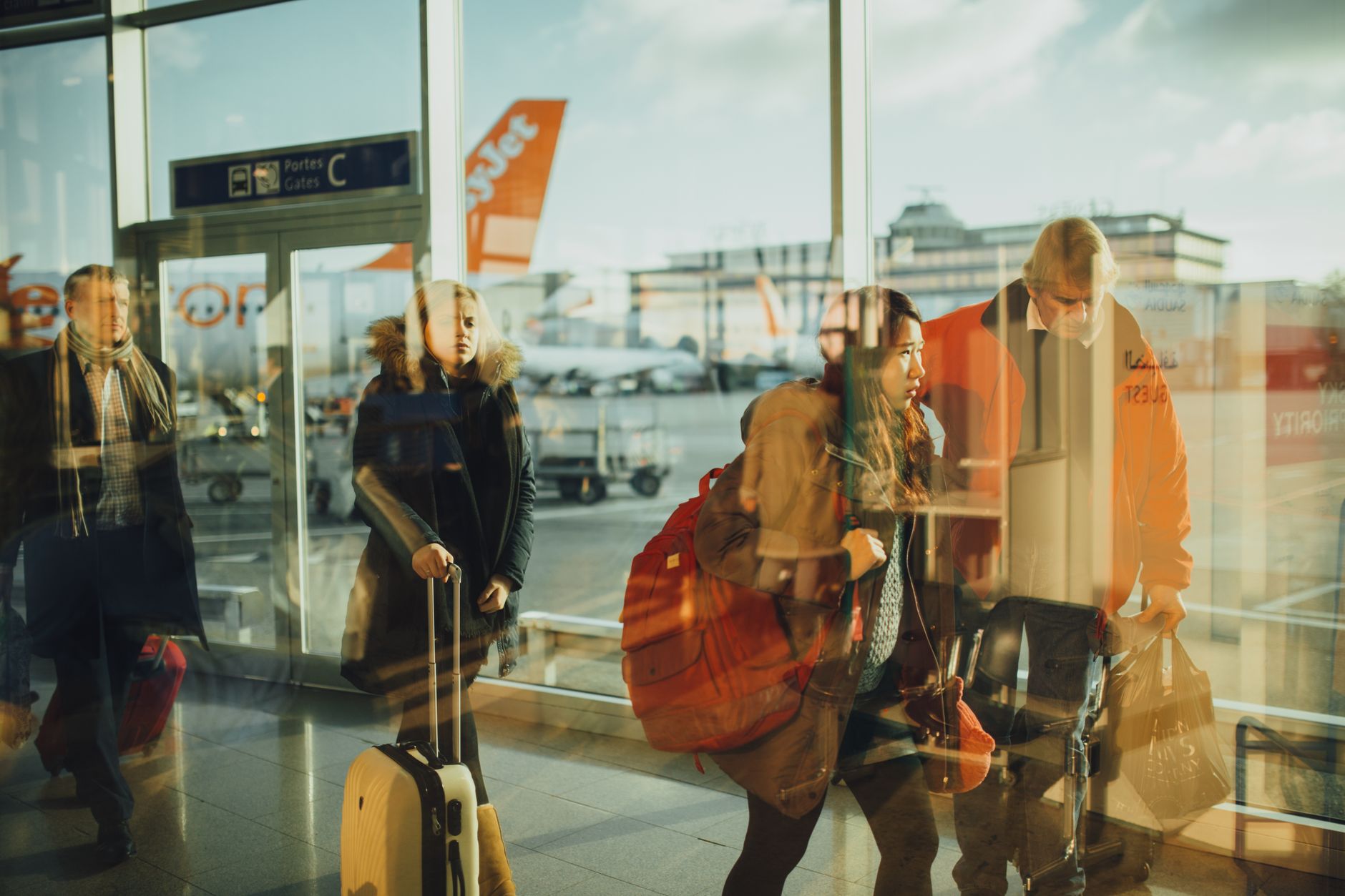 Traveler using a smartphone for mobile check-in in an airport terminal